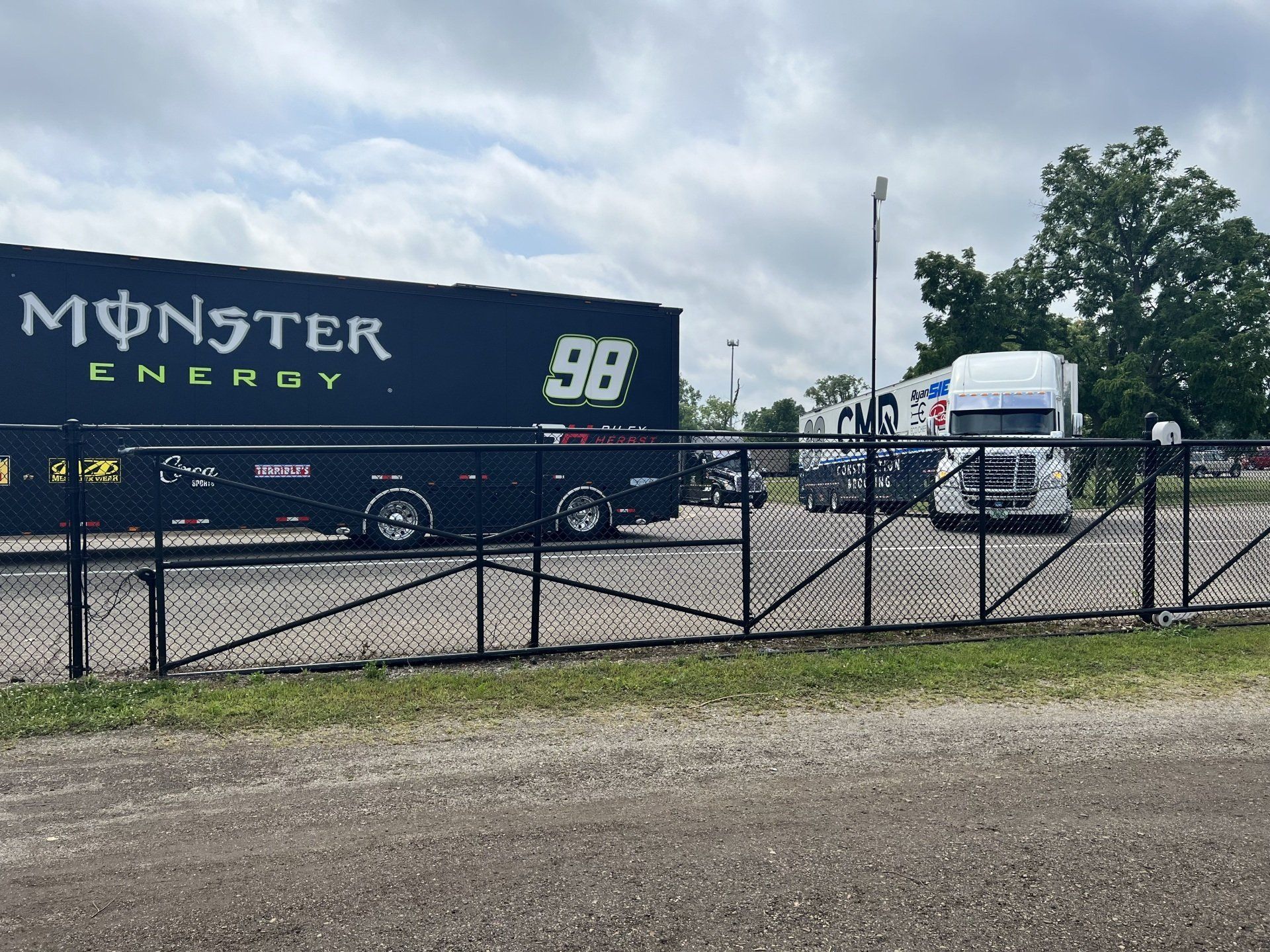 A monster energy truck is parked in a parking lot