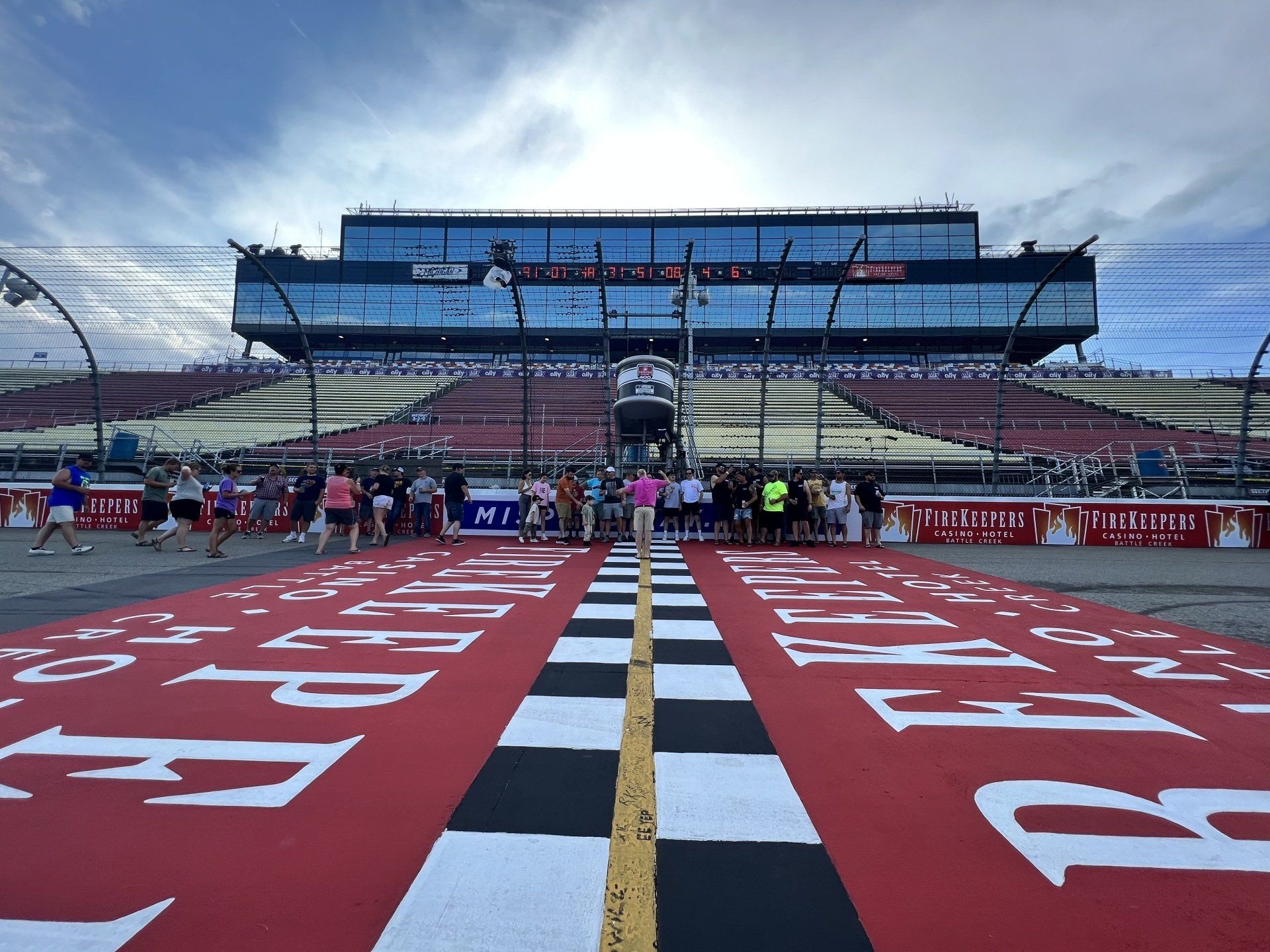 A race track with a large building in the background