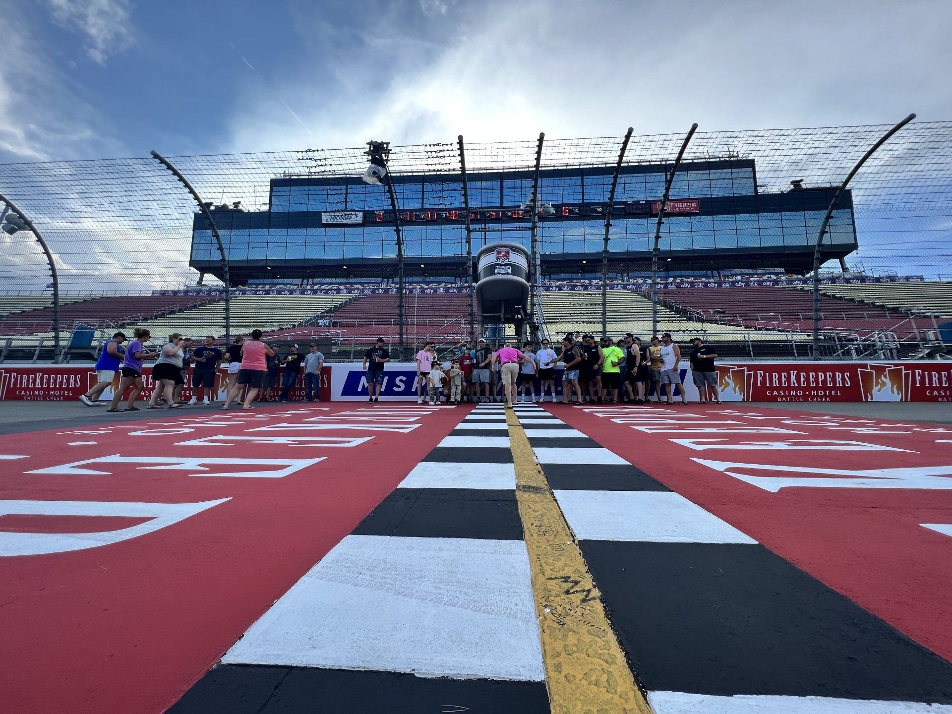 A race track with a large building in the background