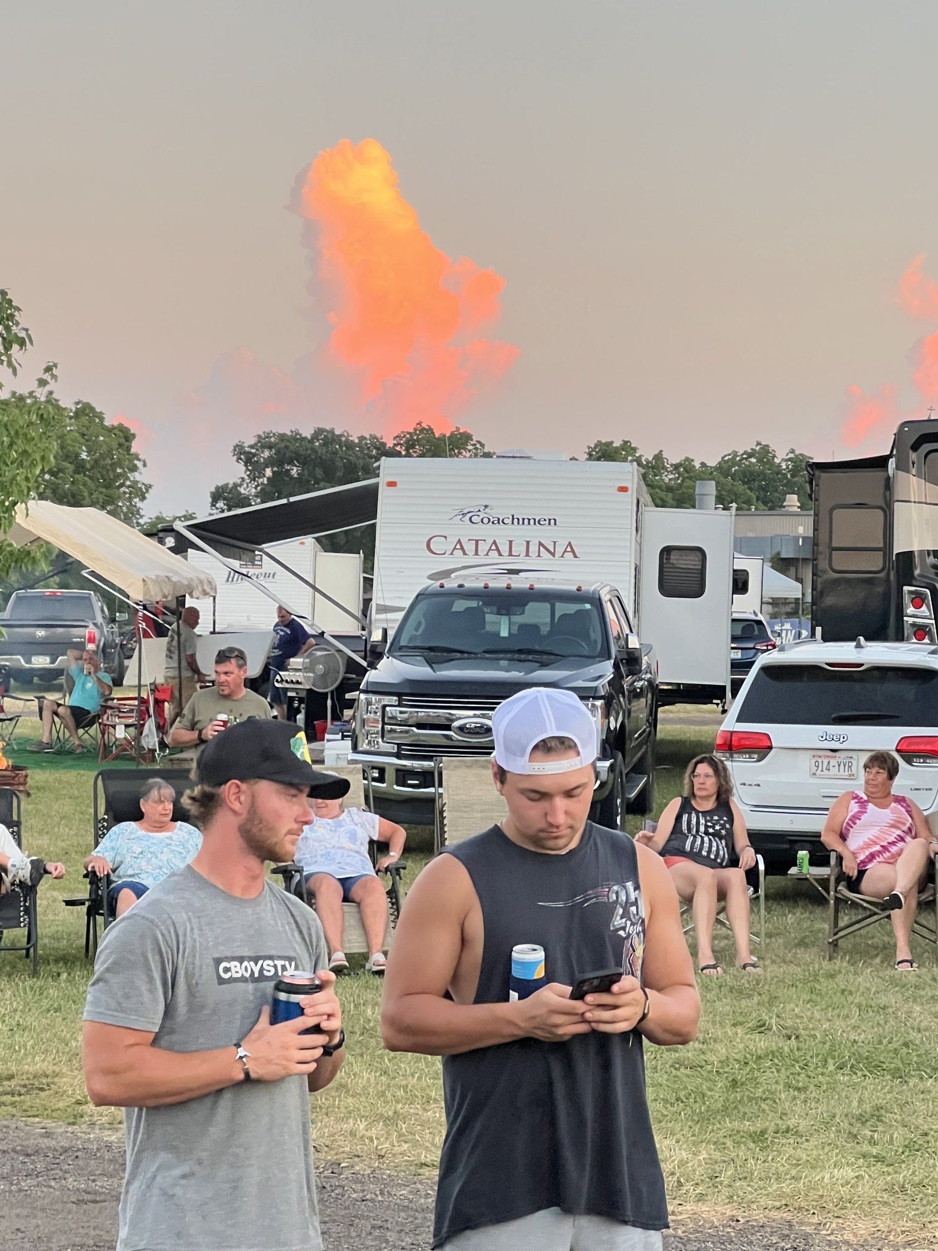 Two men standing in front of a catalina trailer