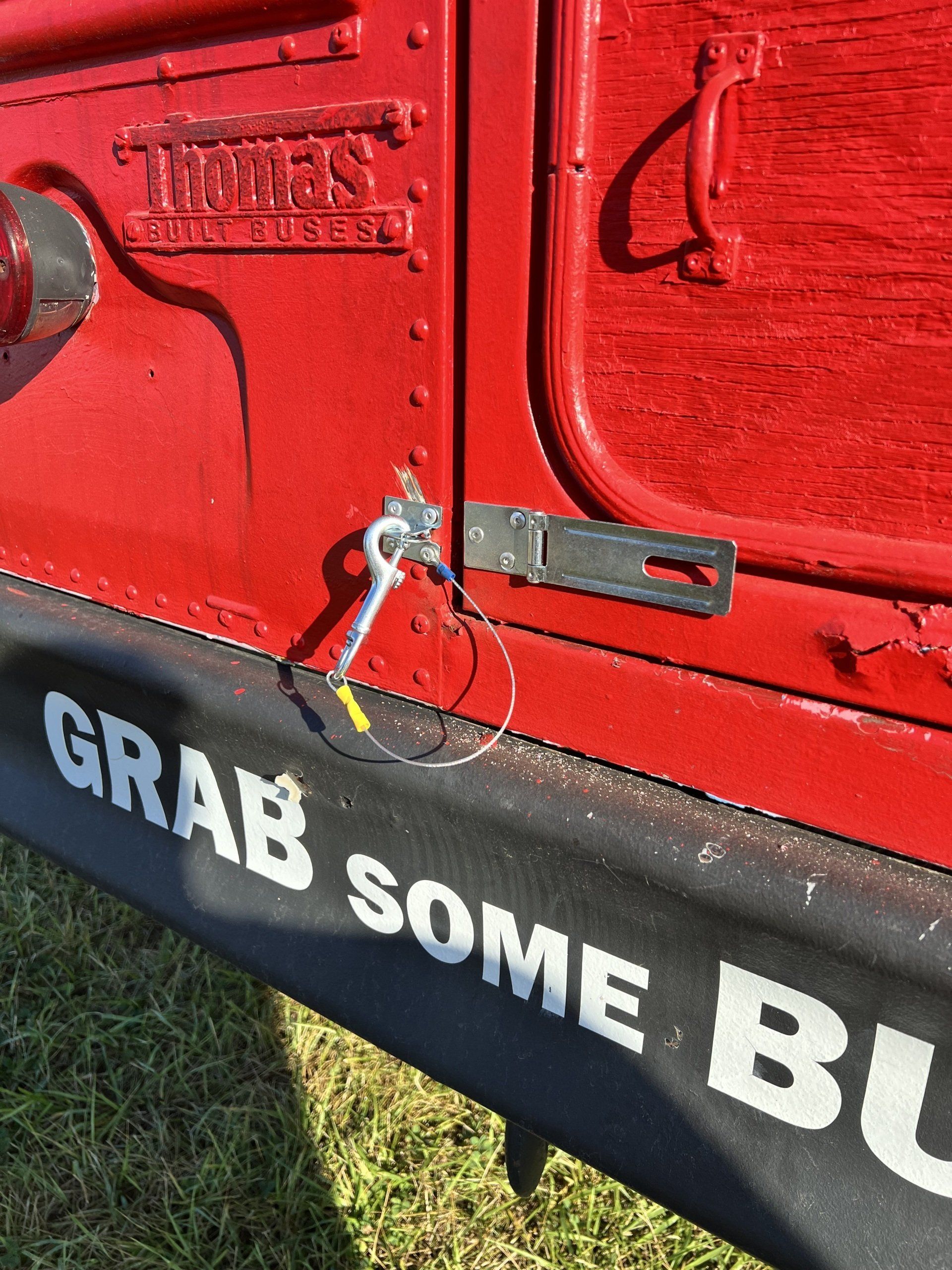 A red truck with the words grab some bu on the side