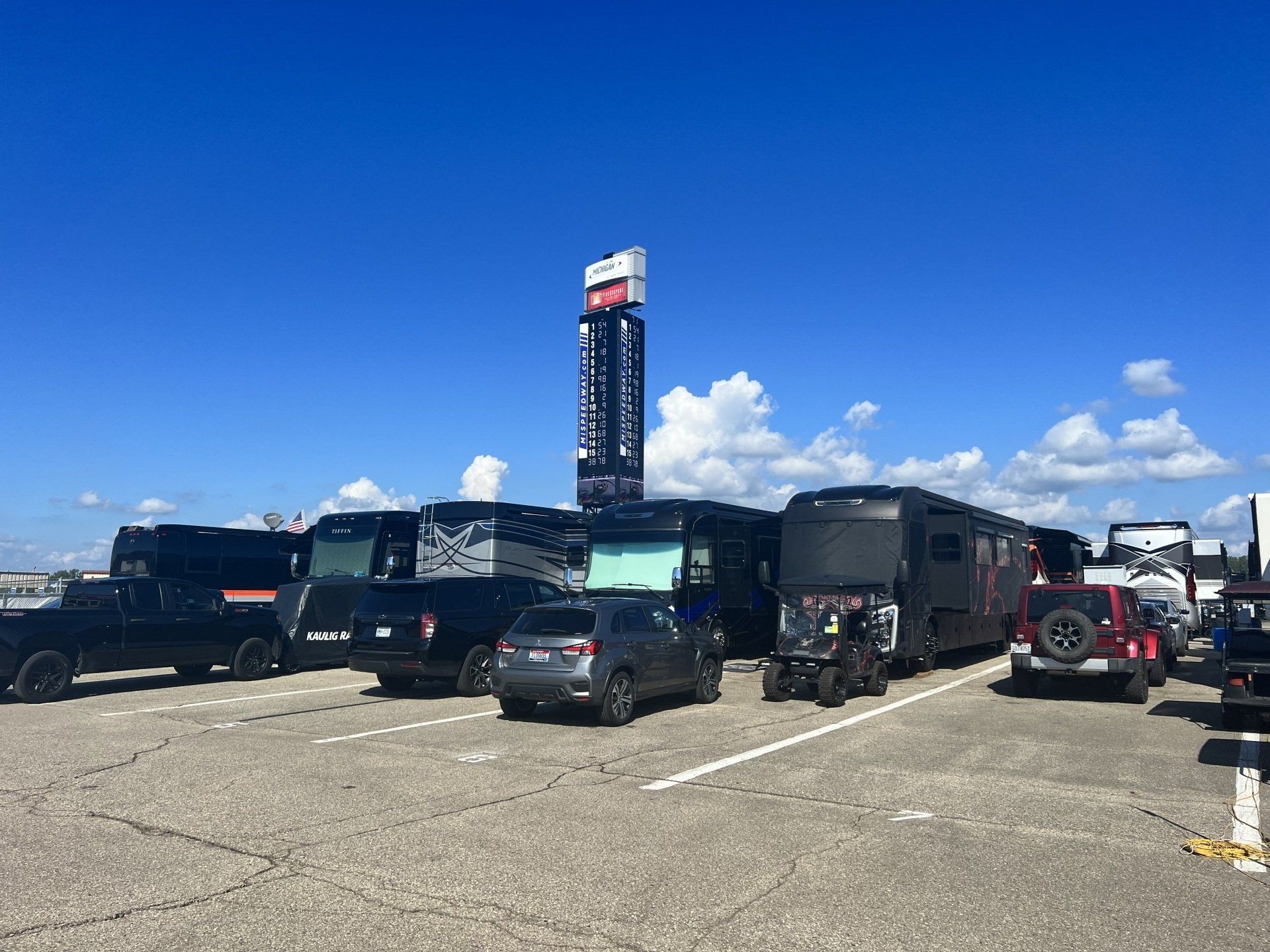 A lot of cars are parked in a parking lot.