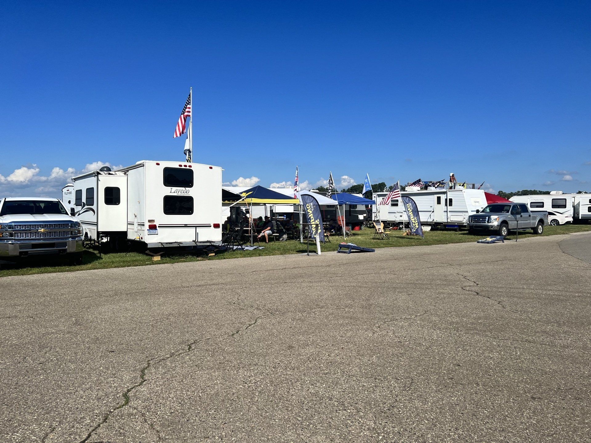 A lot of rvs are parked in a parking lot