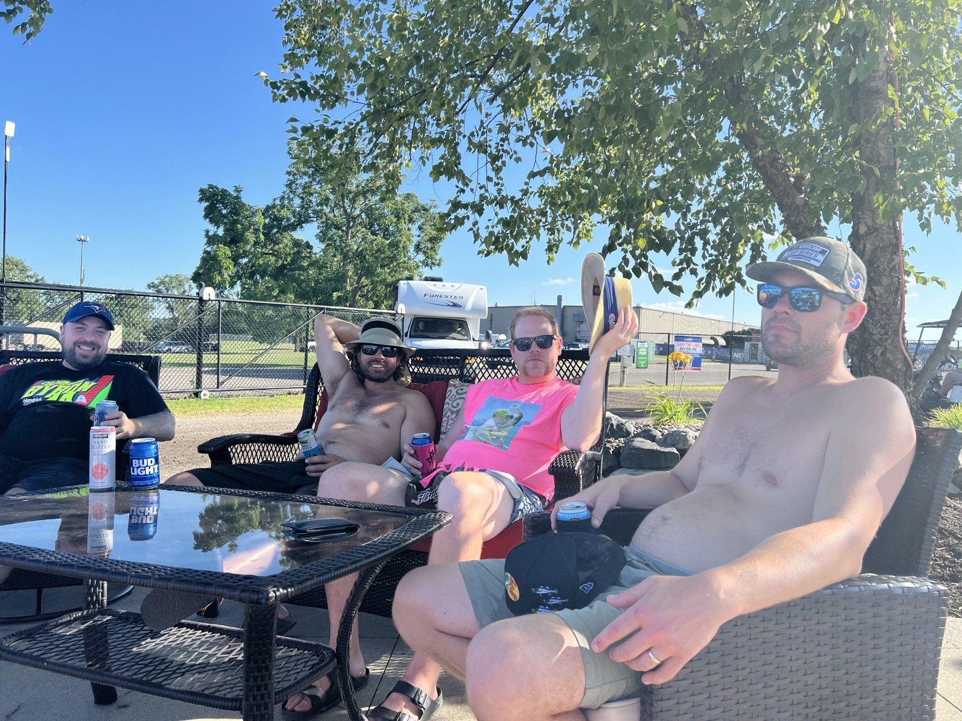 A group of people are sitting around a table outdoors