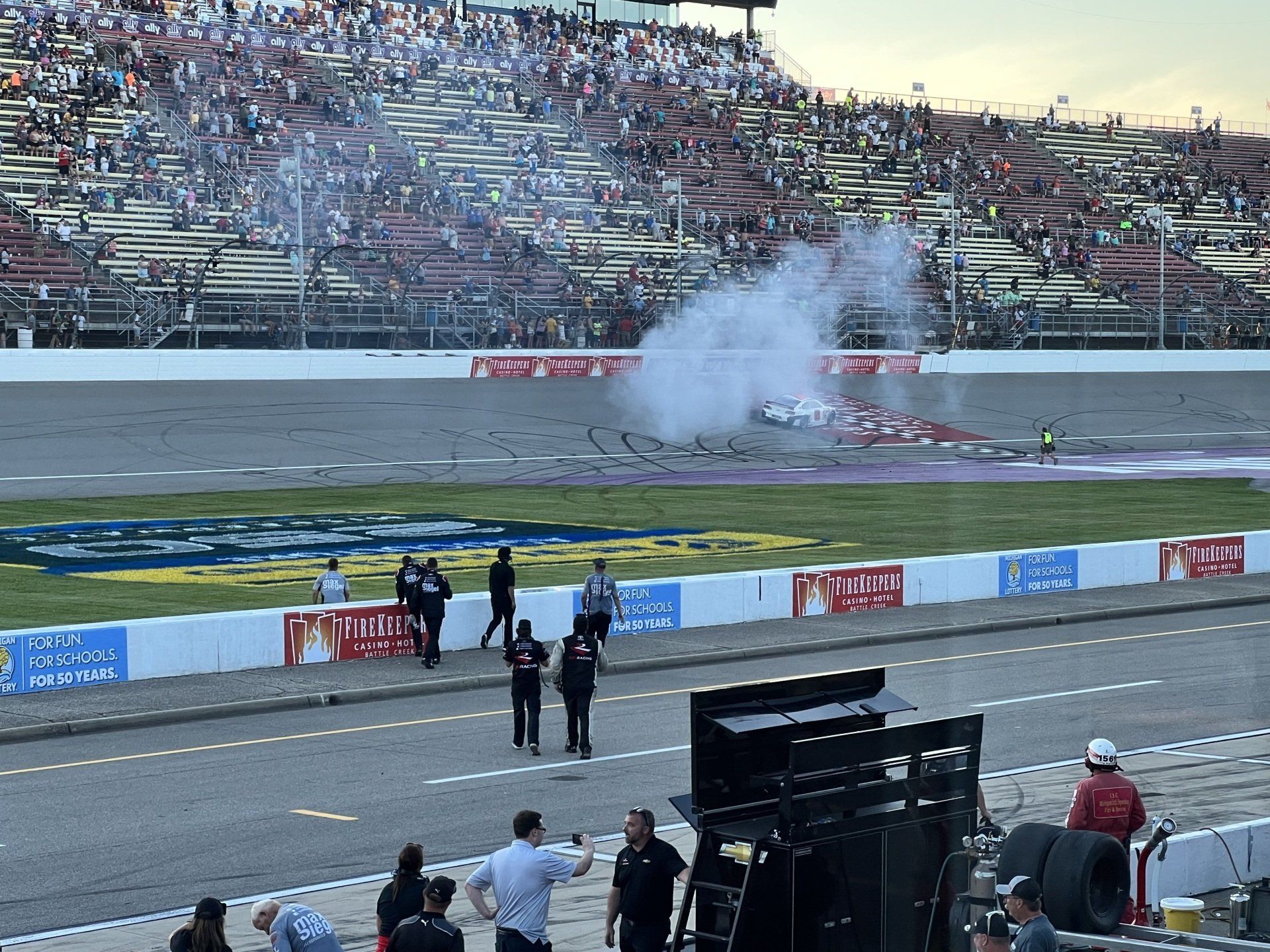 A race track with smoke coming out of the car