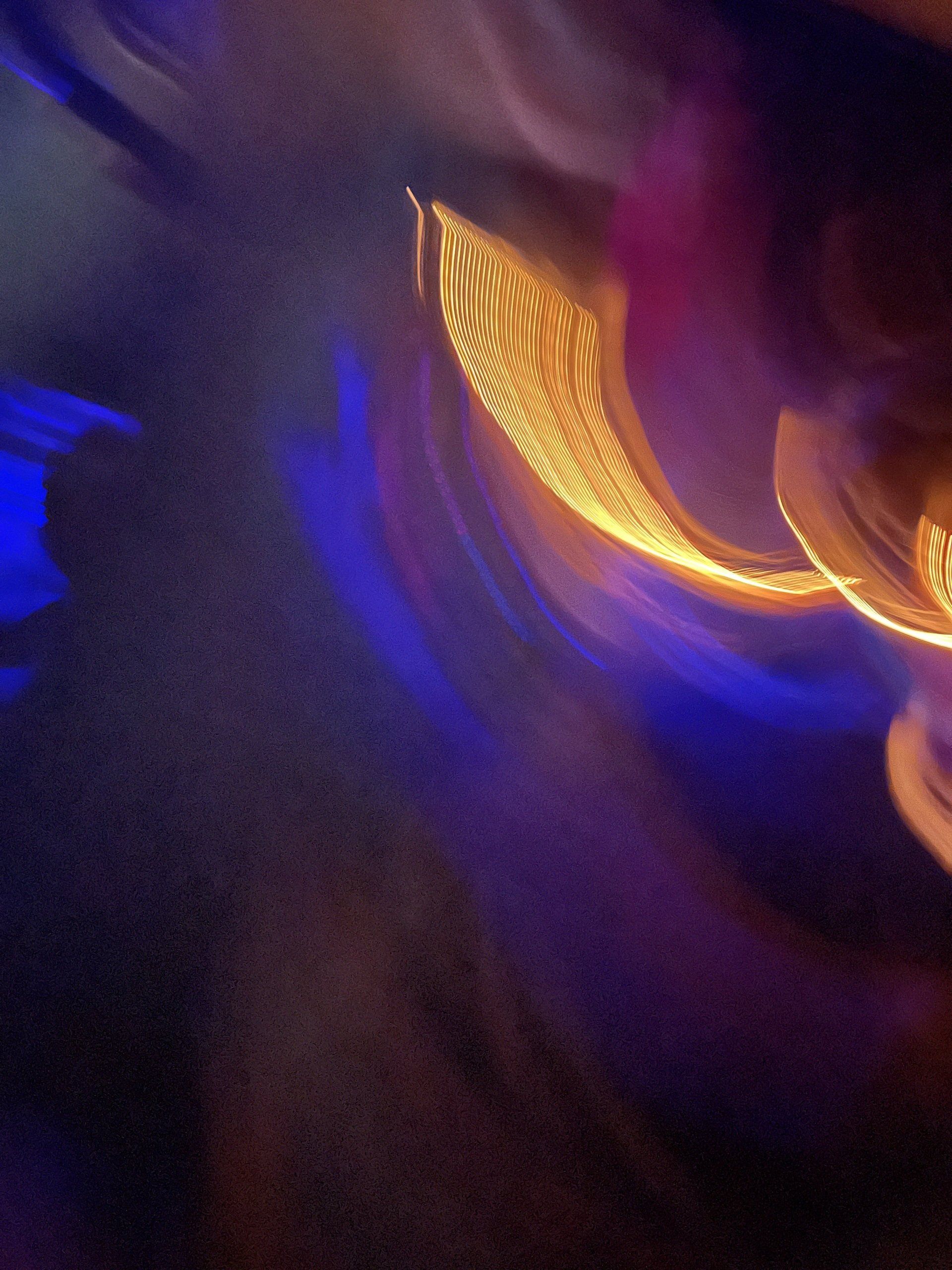 A blurry picture of a purple and orange light