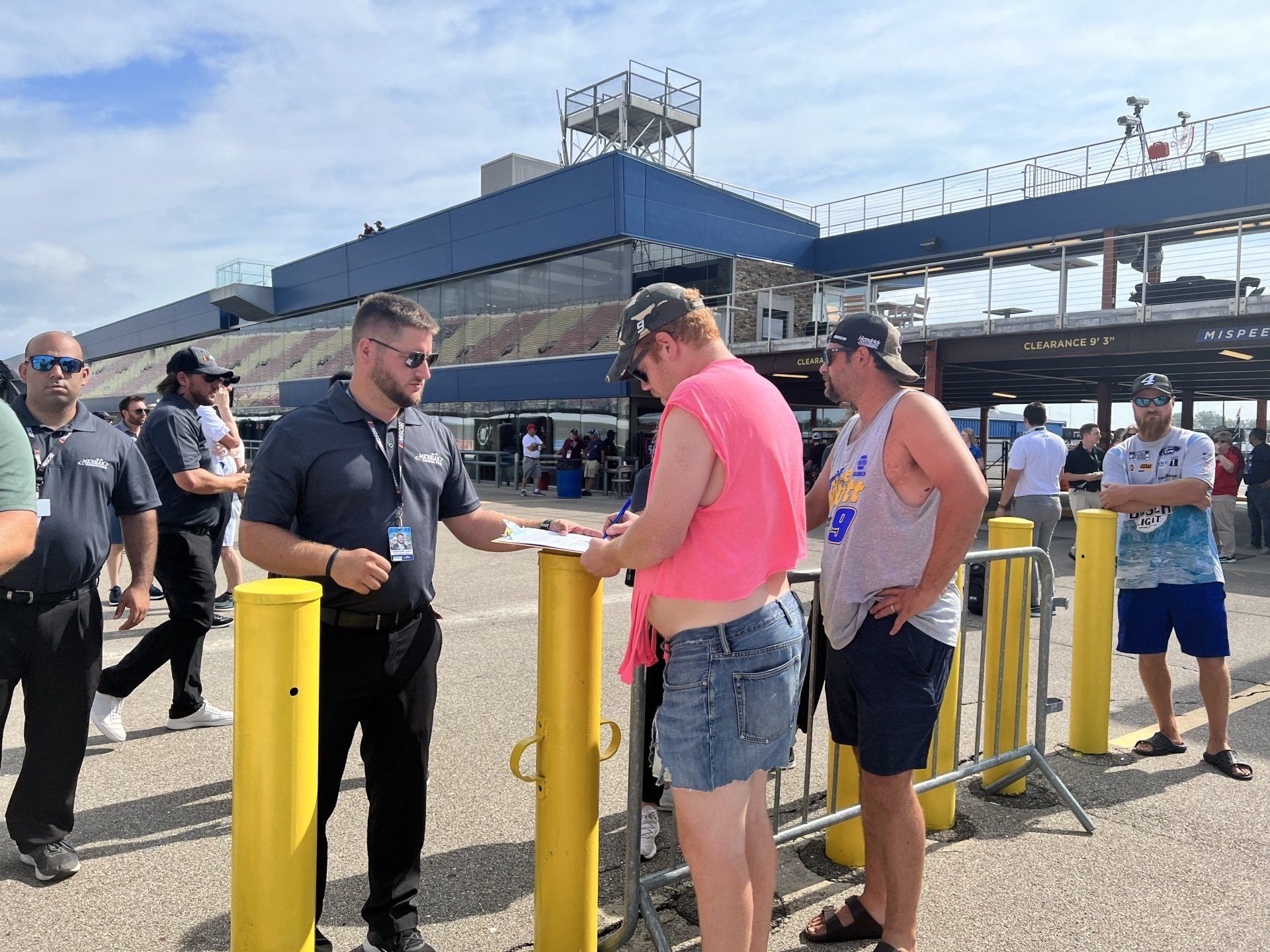 A group of people are standing in front of a building.
