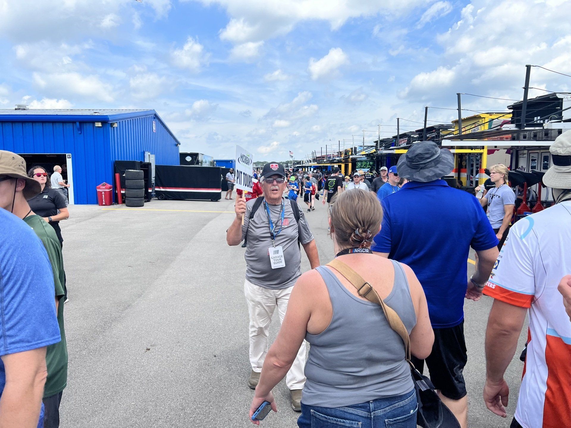 A group of people are walking down a street.