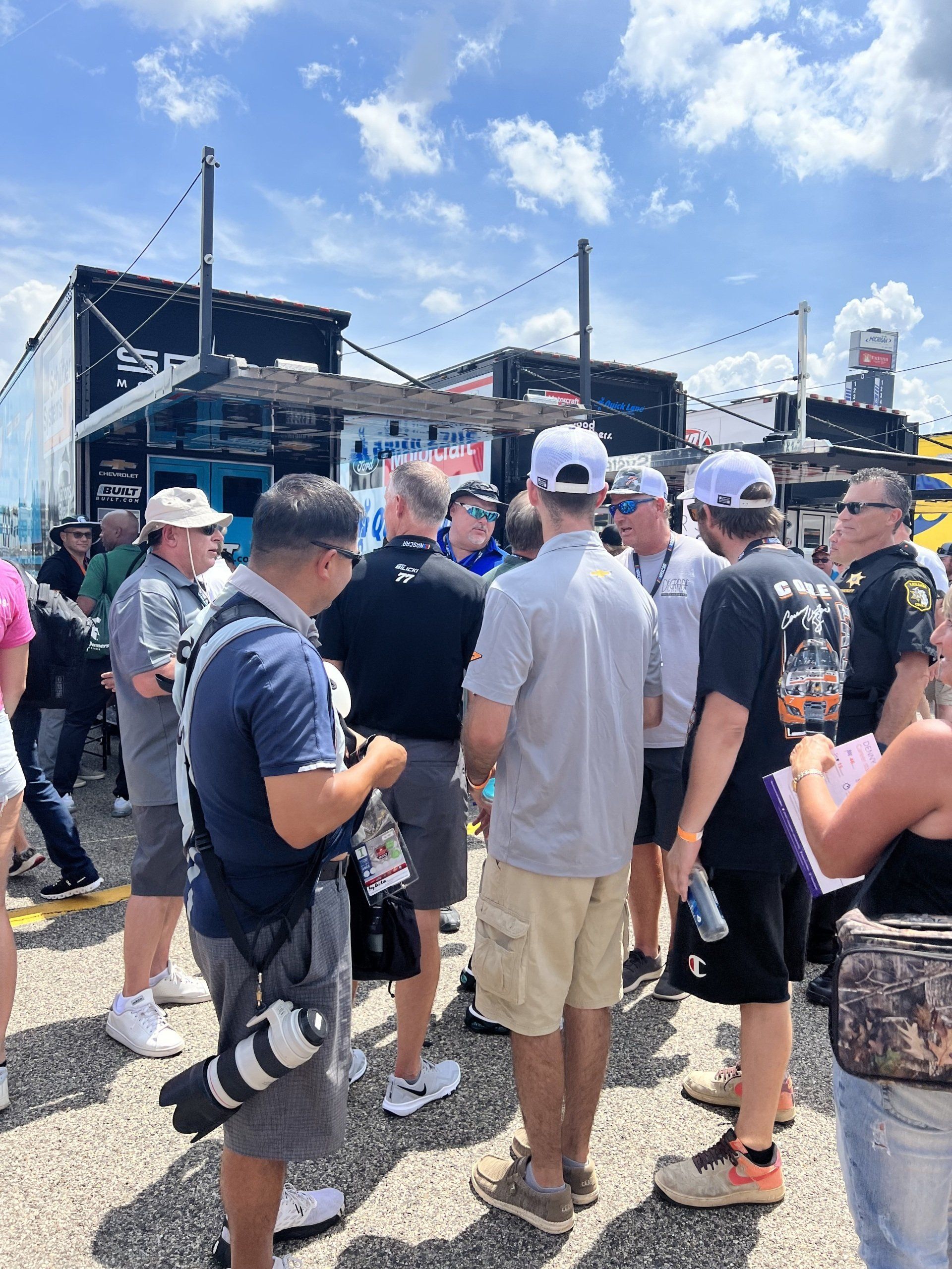 A group of people are standing in front of a building.