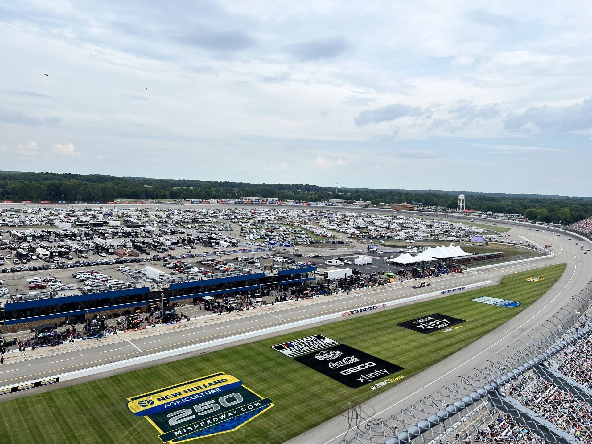 An aerial view of a race track with a lot of people in the stands.