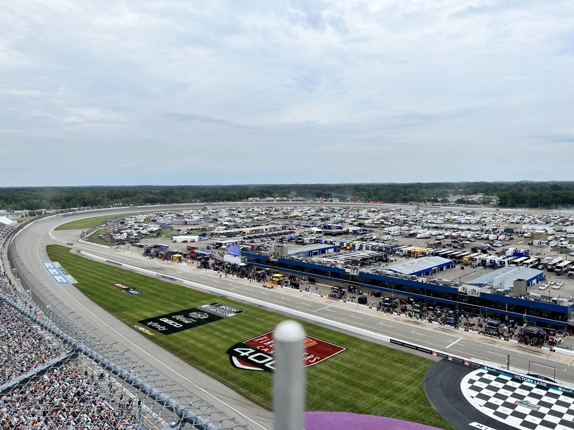 An aerial view of a race track with a lot of people in the stands