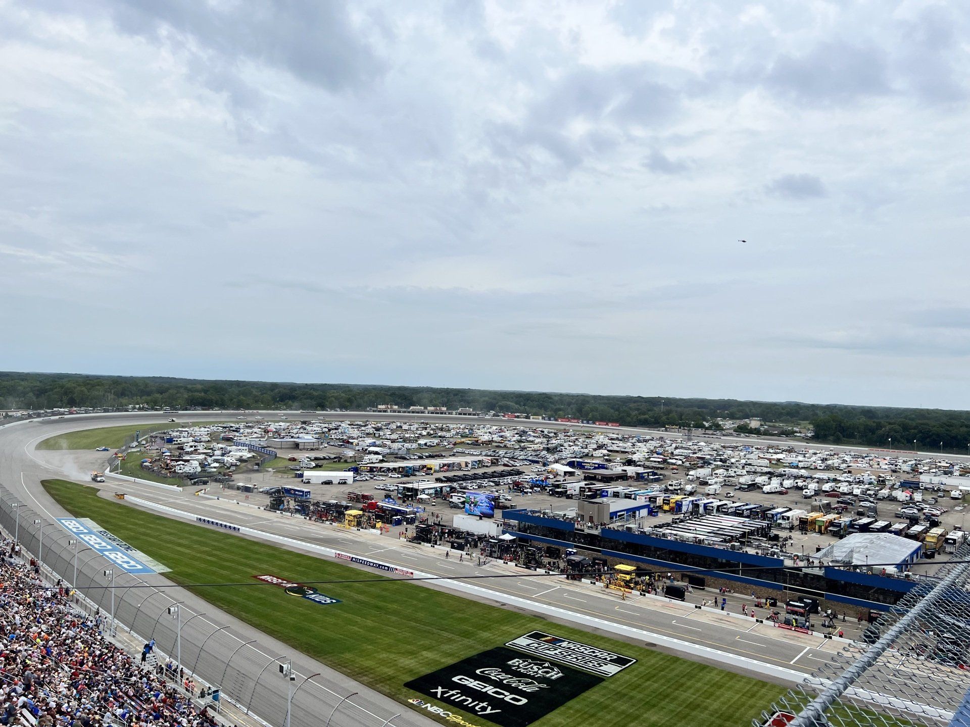 An aerial view of a race track with a lot of people watching.