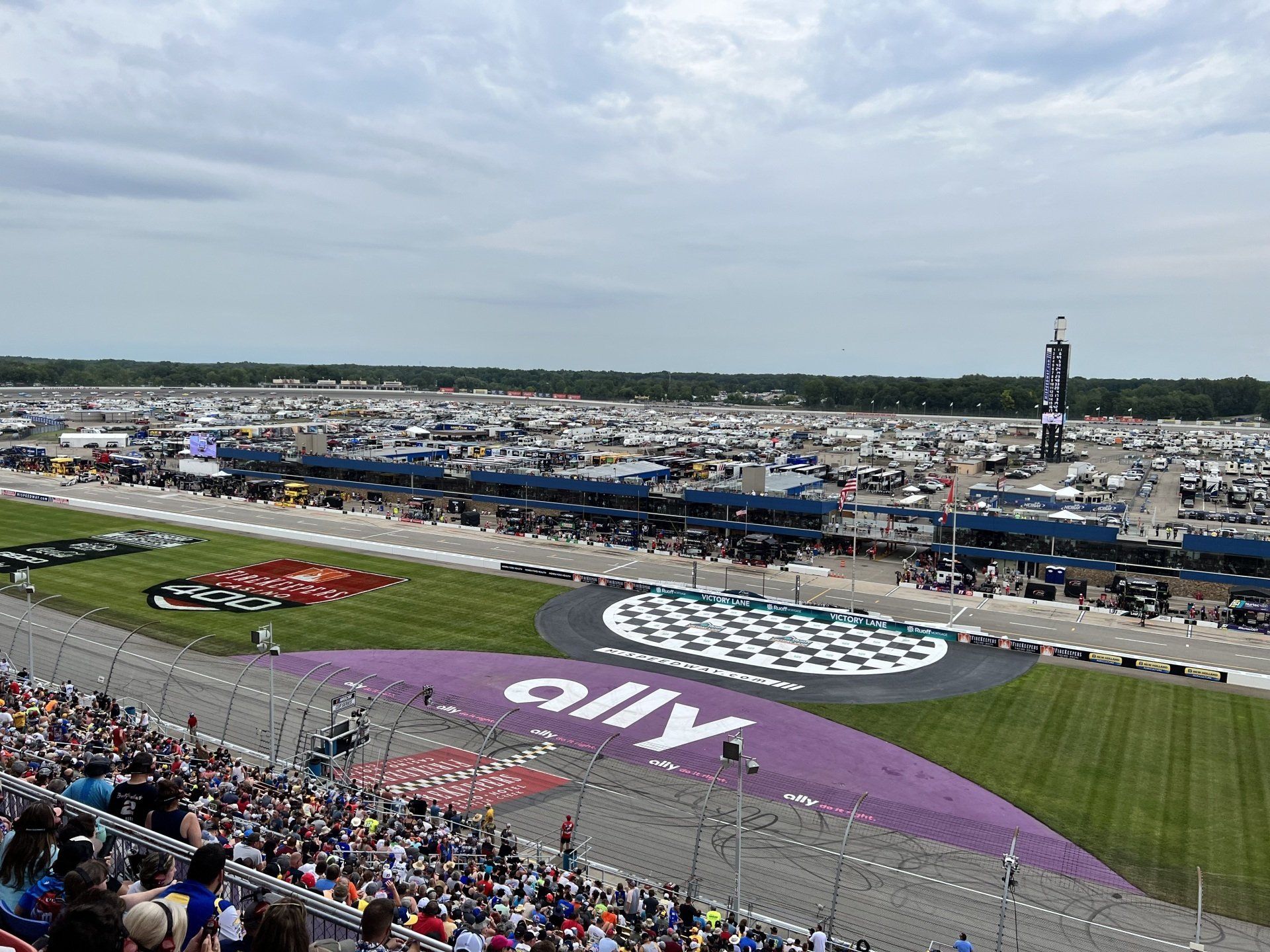 A race track with a large ally logo on the side