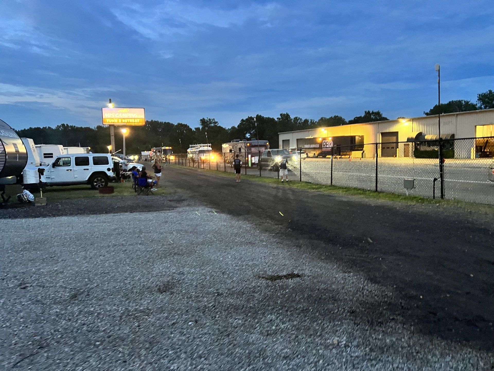 A lot of rvs are parked in a parking lot