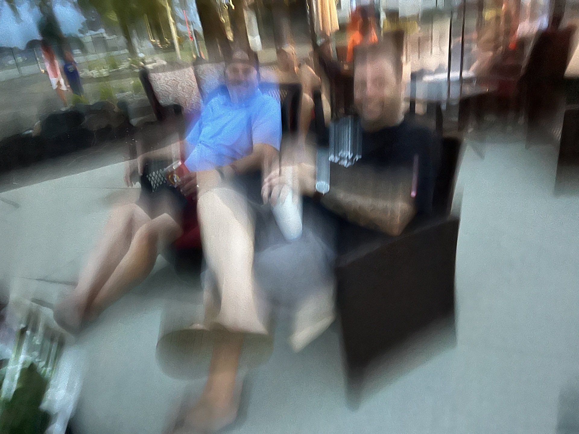 A blurry picture of a group of people sitting at a table.