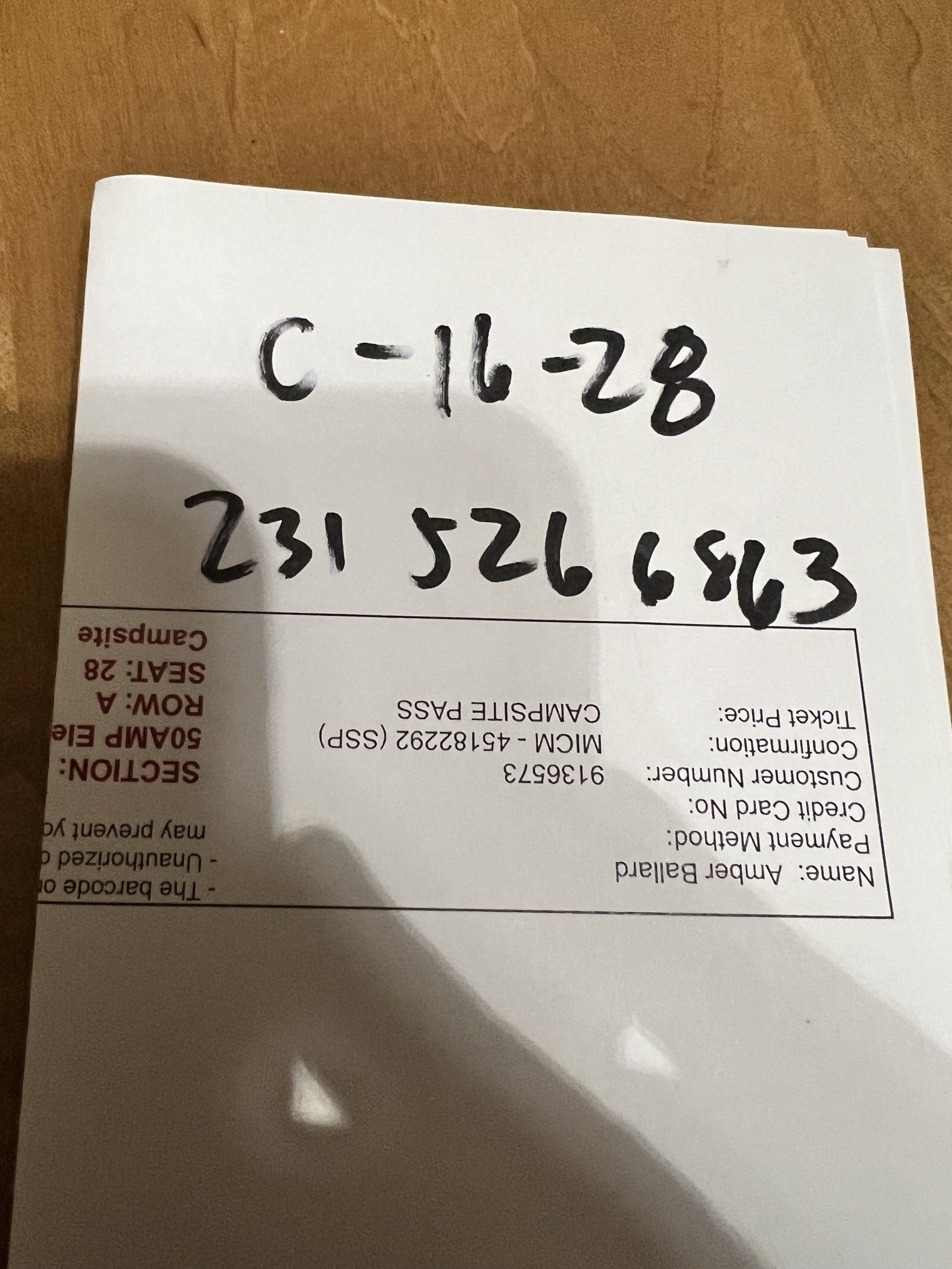 A piece of paper with the numbers 238125132 written on it