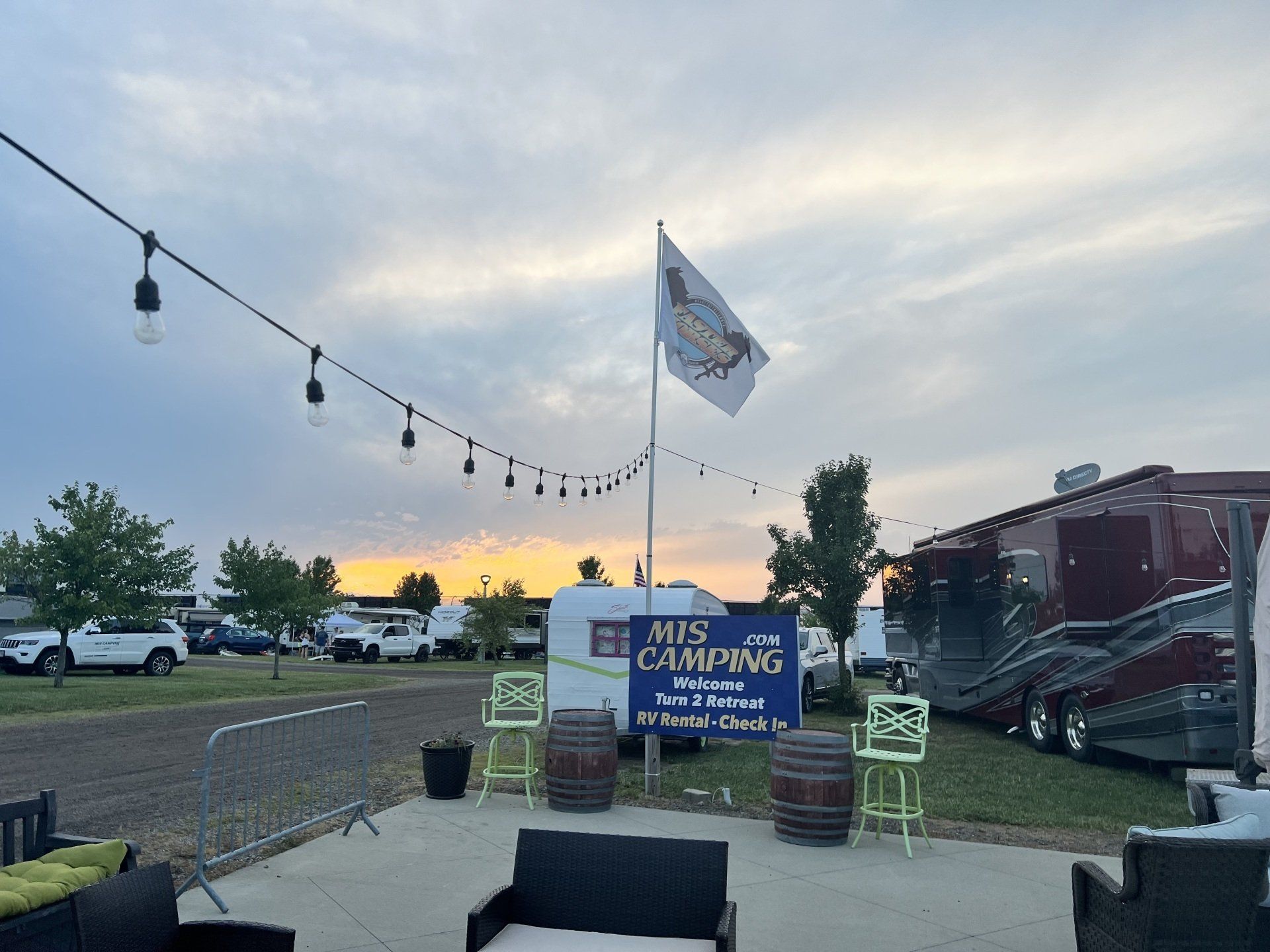A patio area with a sign that says `` his camping '' on it.