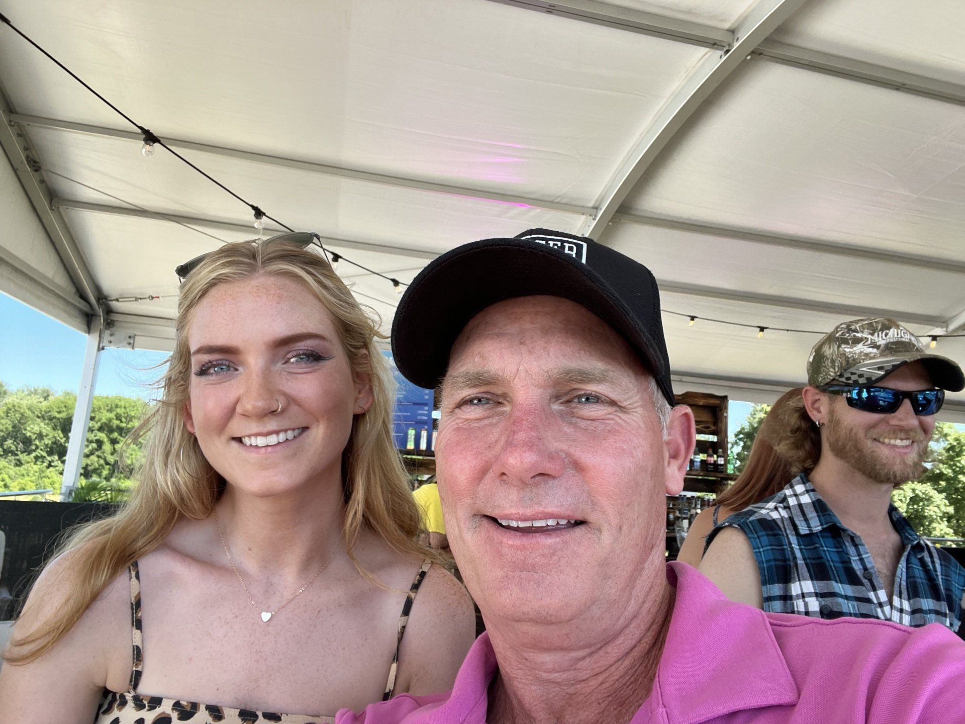 A man and a woman are posing for a picture on a boat.