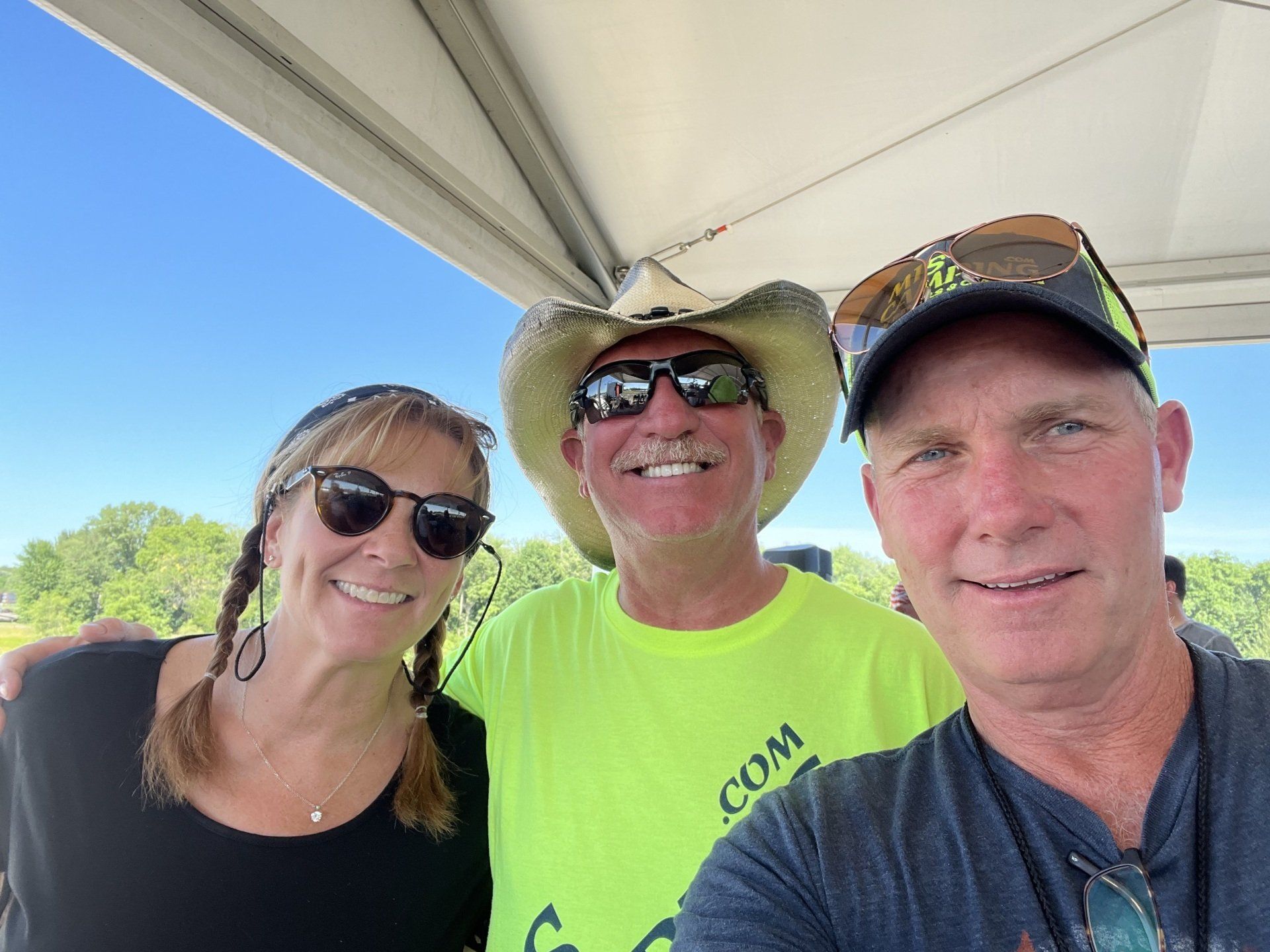 A group of people are posing for a picture on a boat.