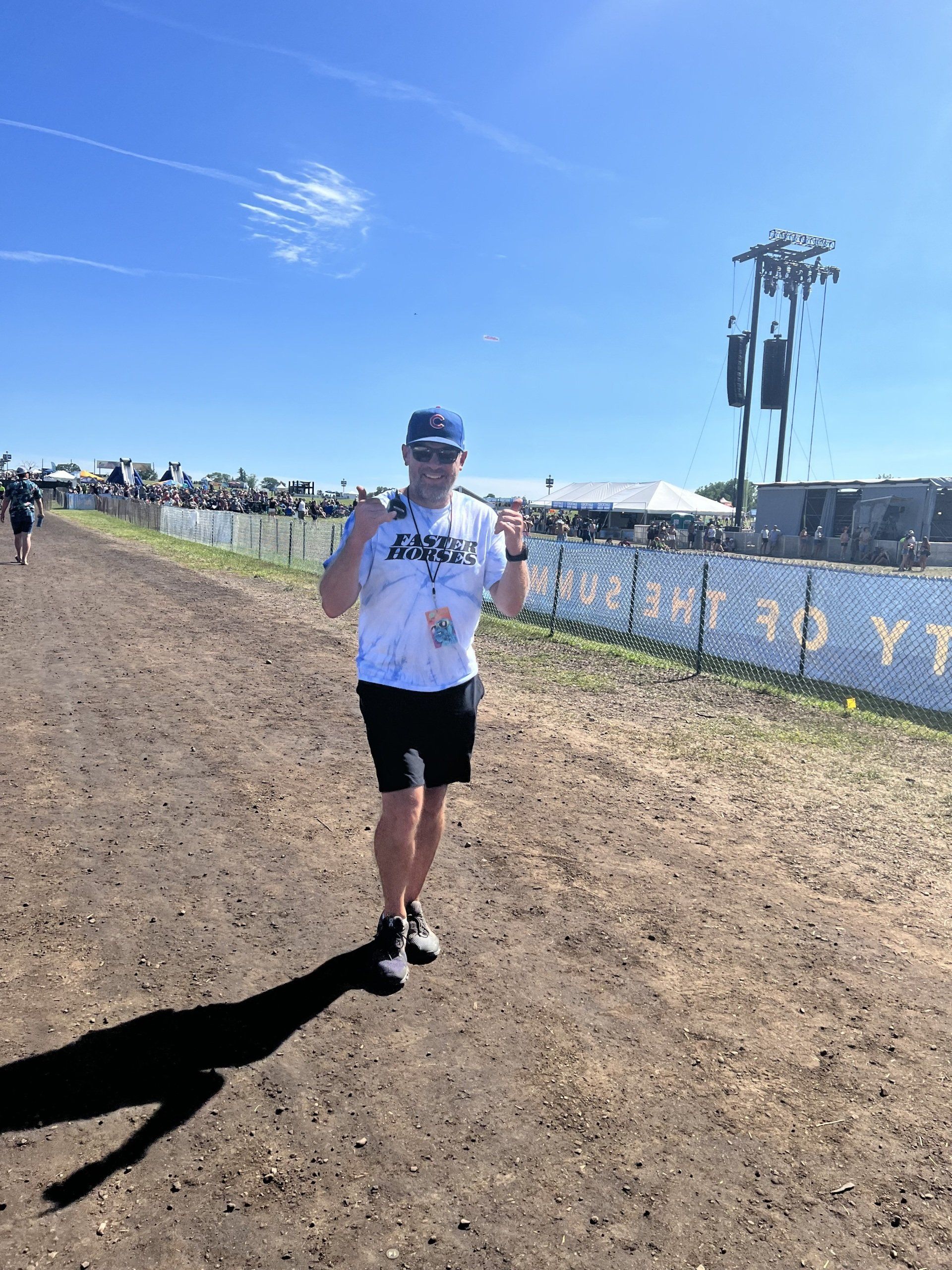 A man is running on a dirt road.