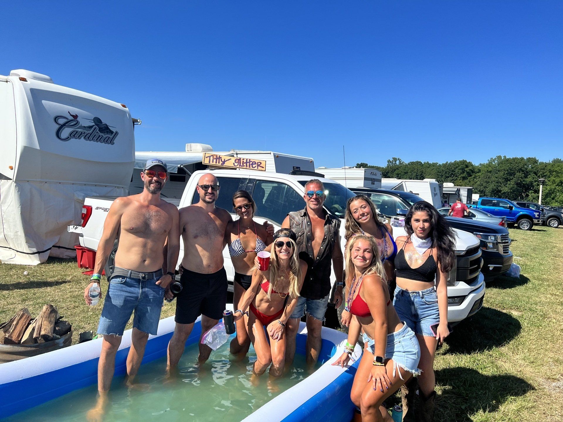 A group of people are standing in a pool of water.