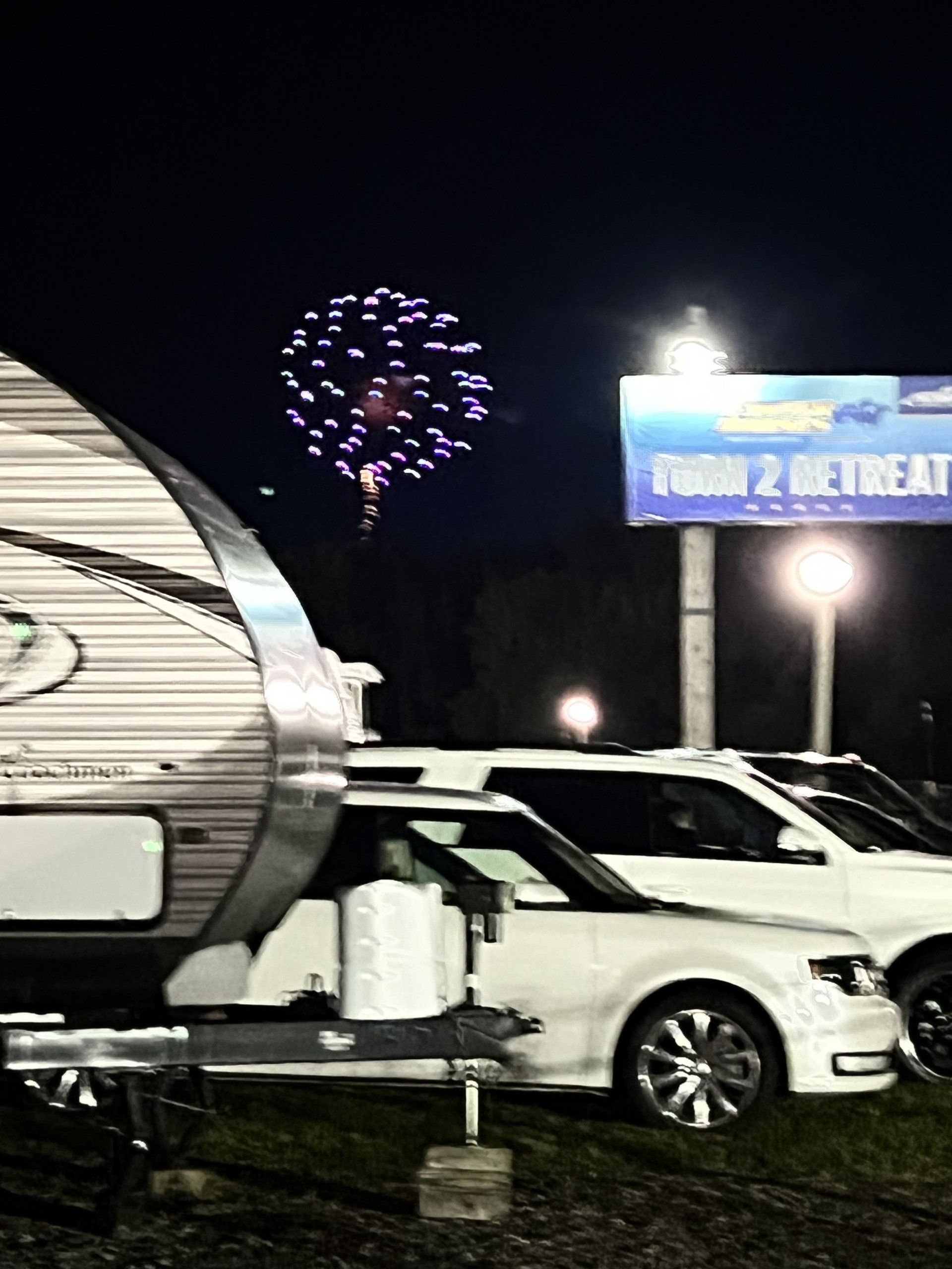 A trailer is parked in front of a sign that says throw 2 retreat
