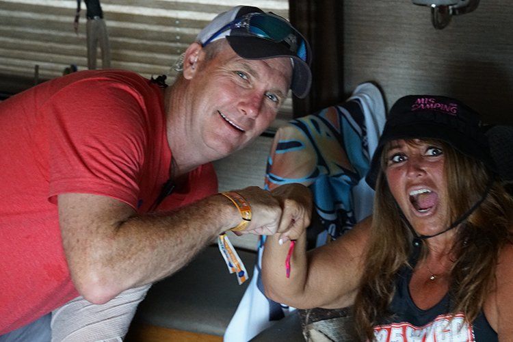 A man and a woman are posing for a picture together.