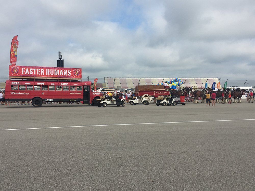 A red bus with the words faster humans on it