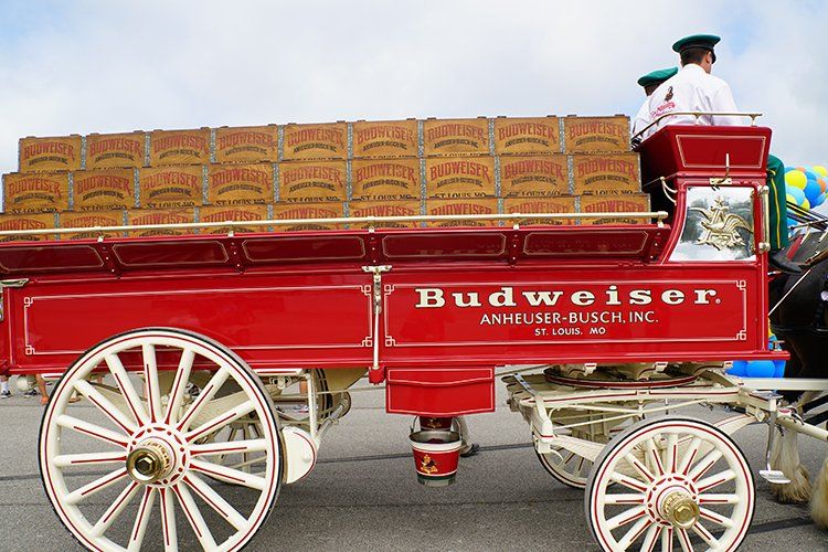A red wagon with budweiser written on it