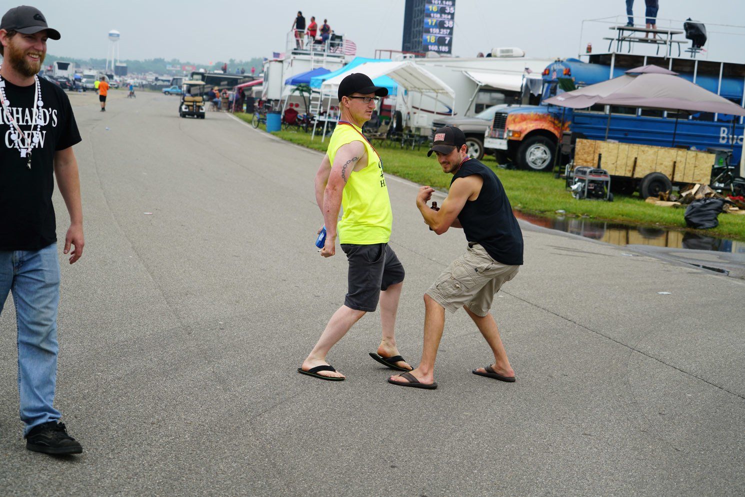 A man wearing a black shirt that says rusters on it