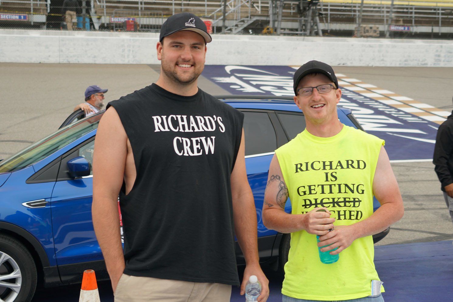 Two men wearing shirts that say richard 's crew