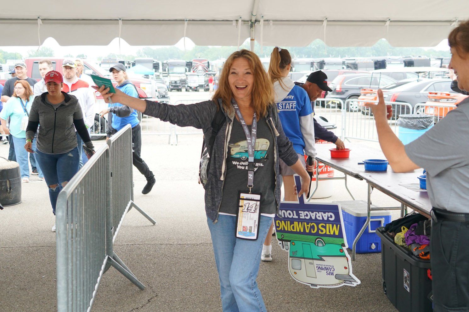 A woman holding a bag that says garage you
