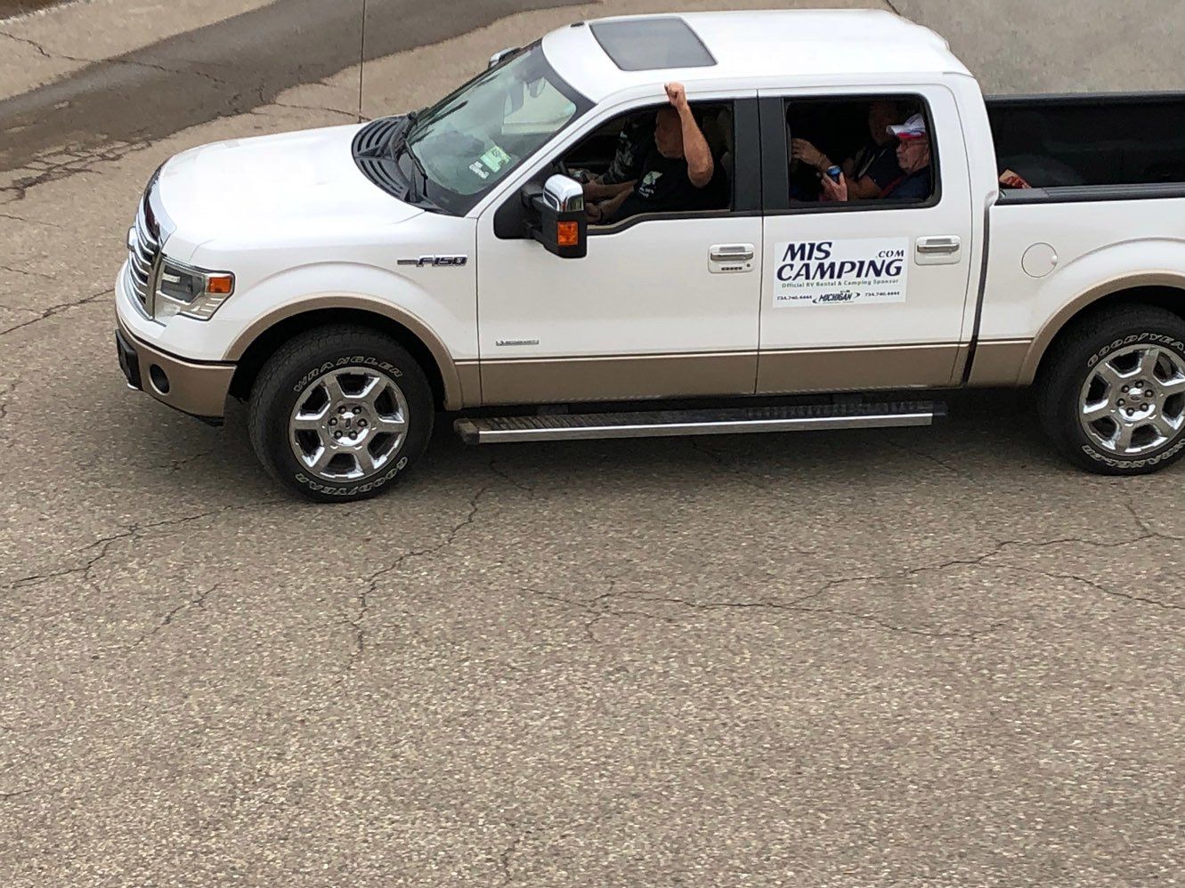 A white truck with the word camping on the side