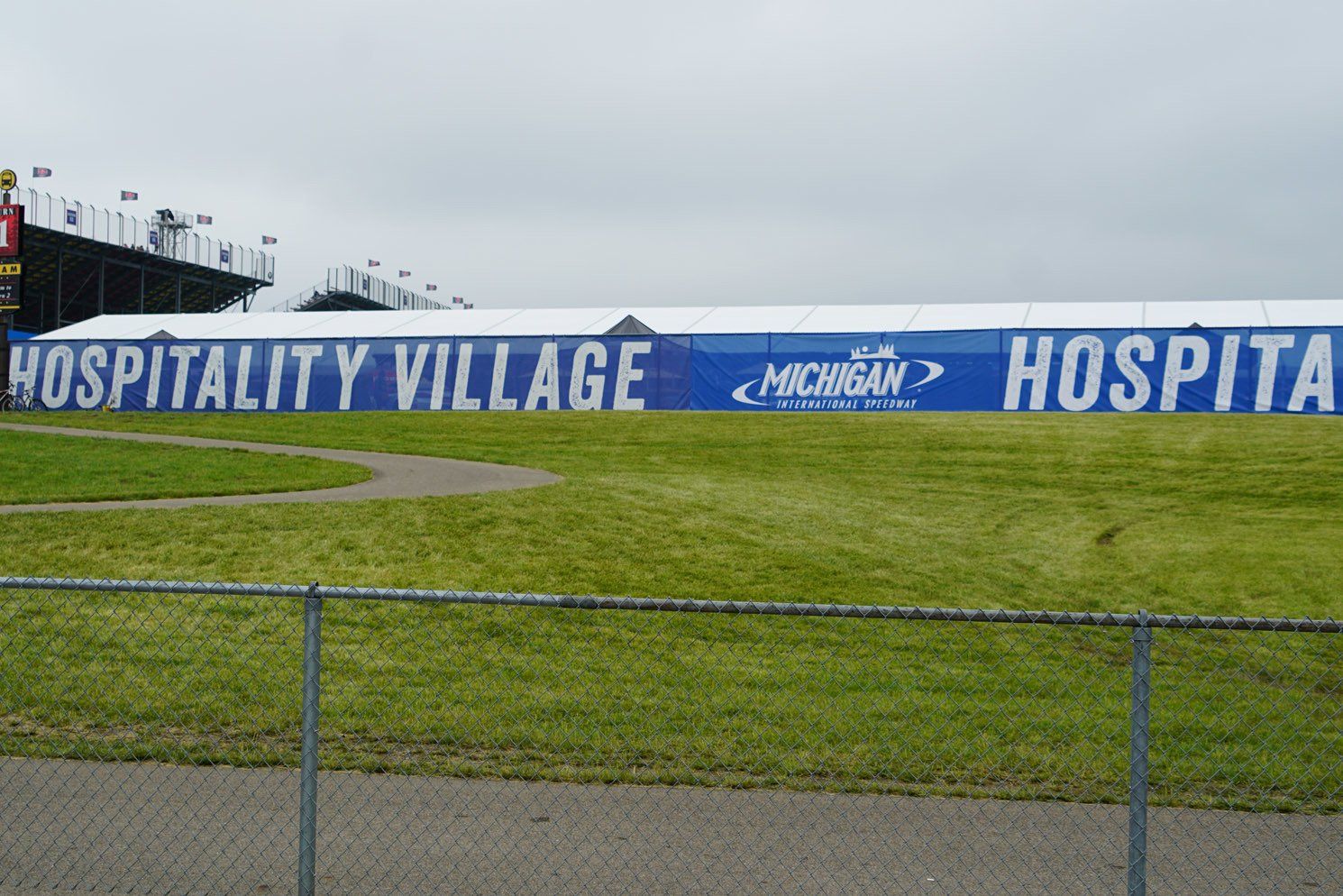 A large sign that says hospitality village on it