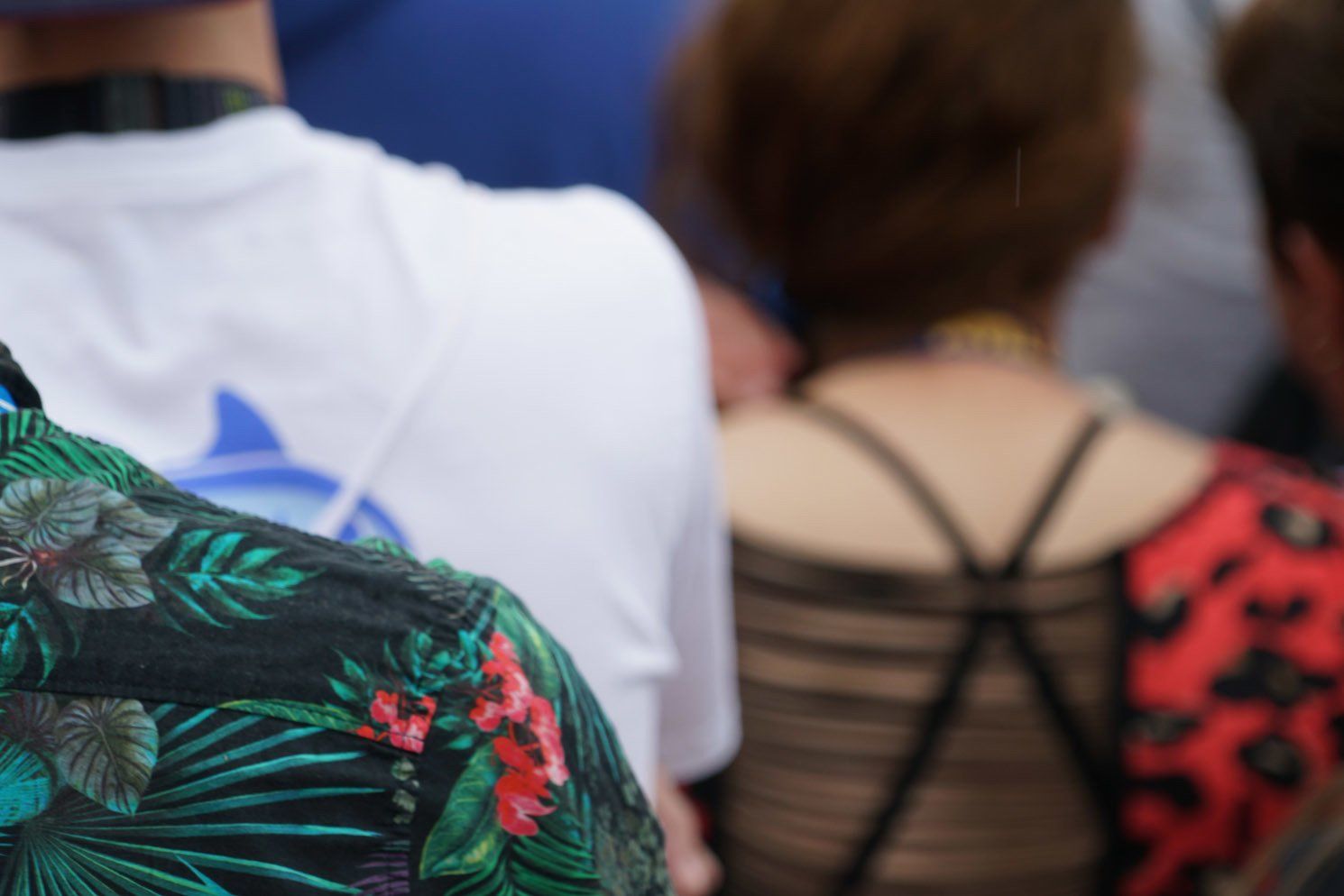 The back of a person wearing a floral shirt