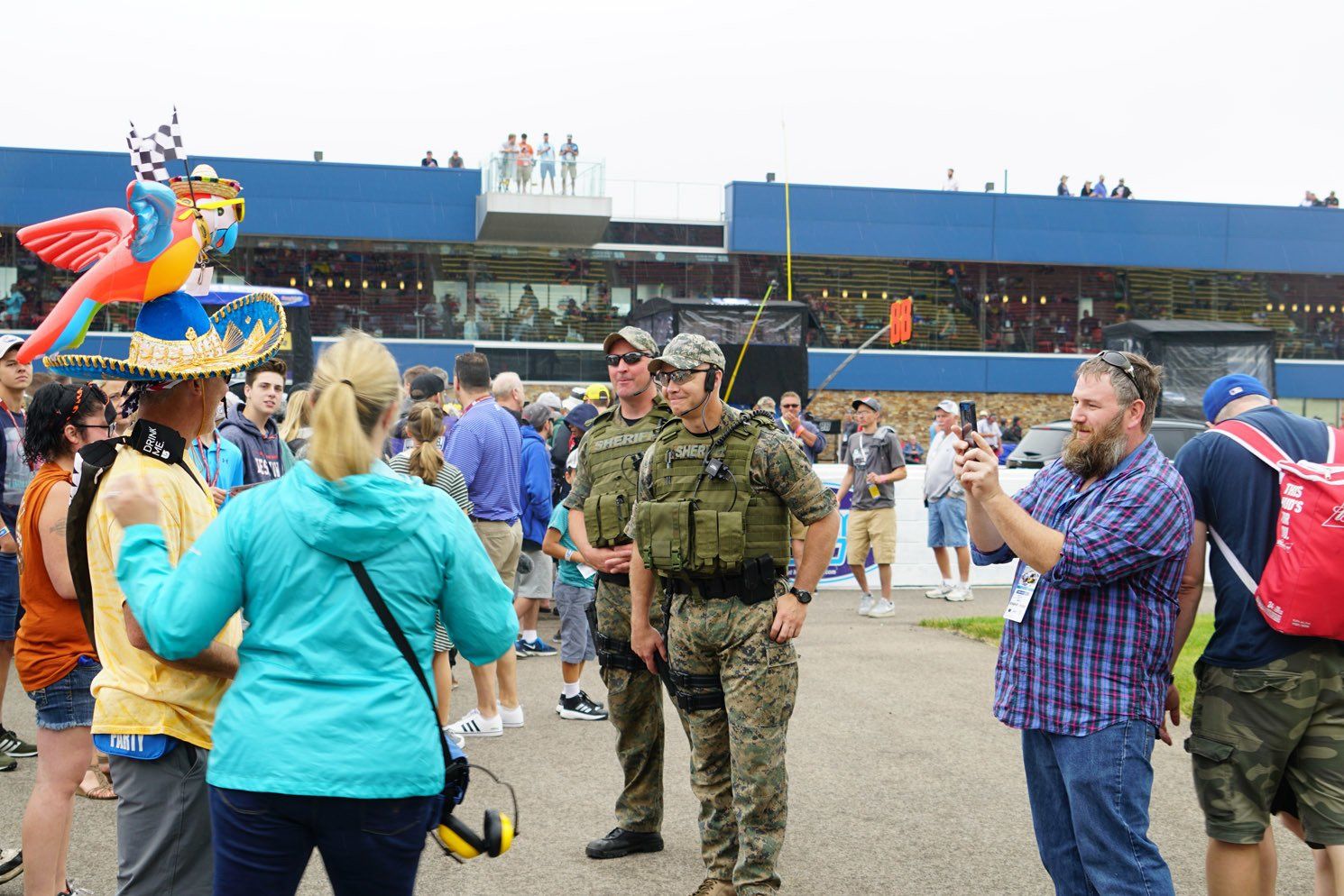 A group of people are standing in front of a building.