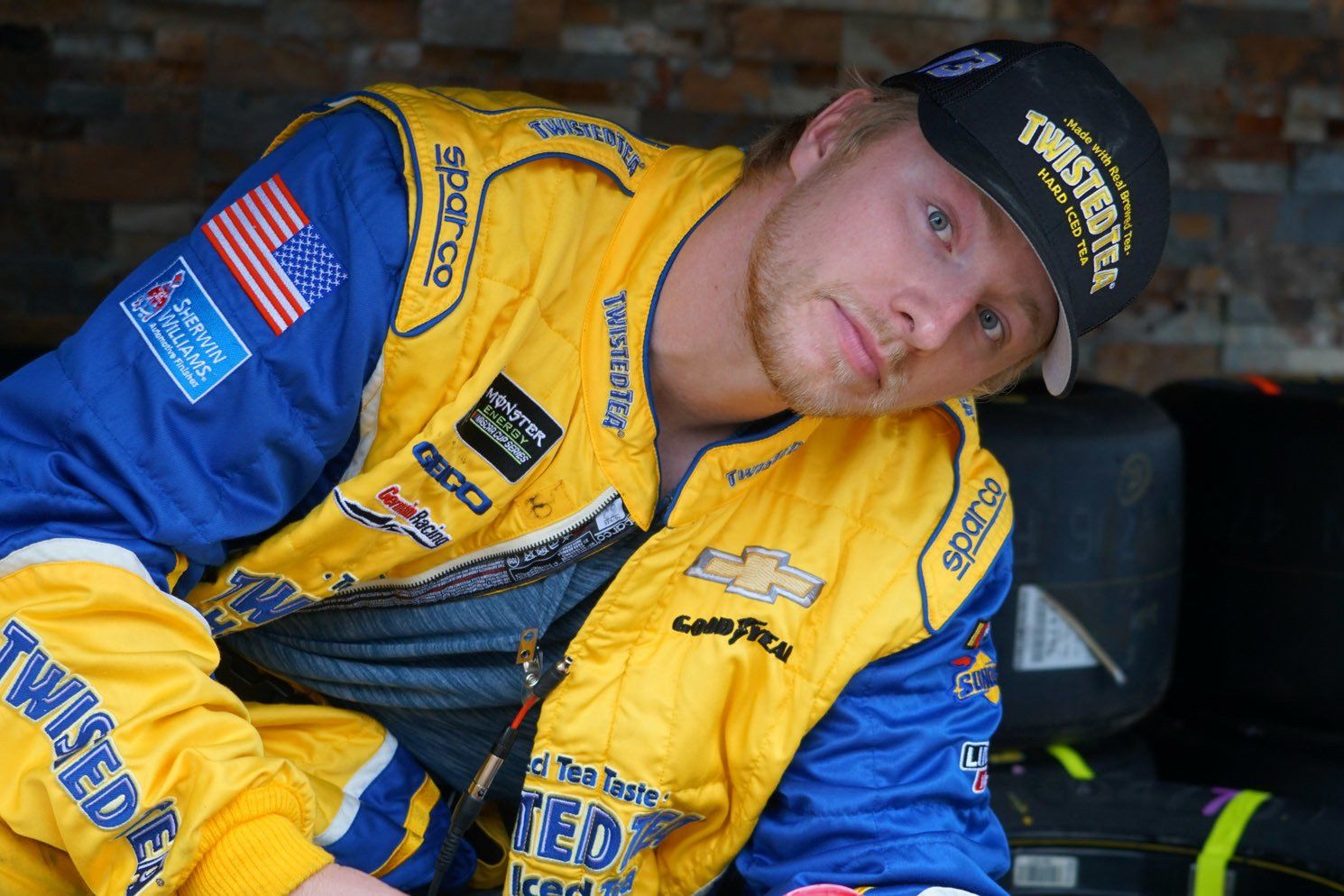 A man wearing a twister hat and a yellow jacket