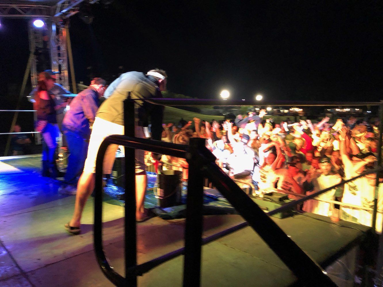 A blurry picture of a crowd of people at a concert