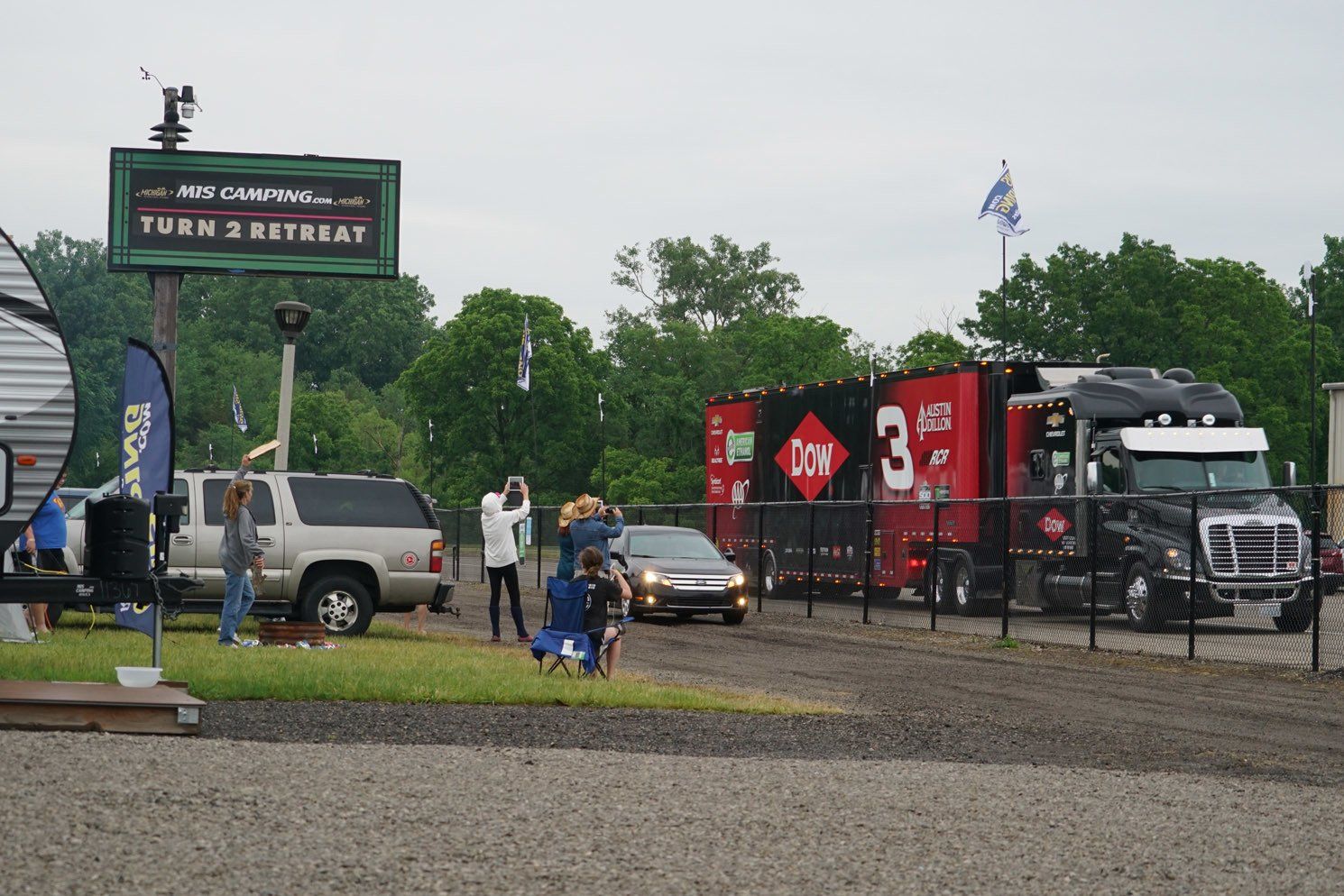 A truck with the number 3 on it is parked in a parking lot.