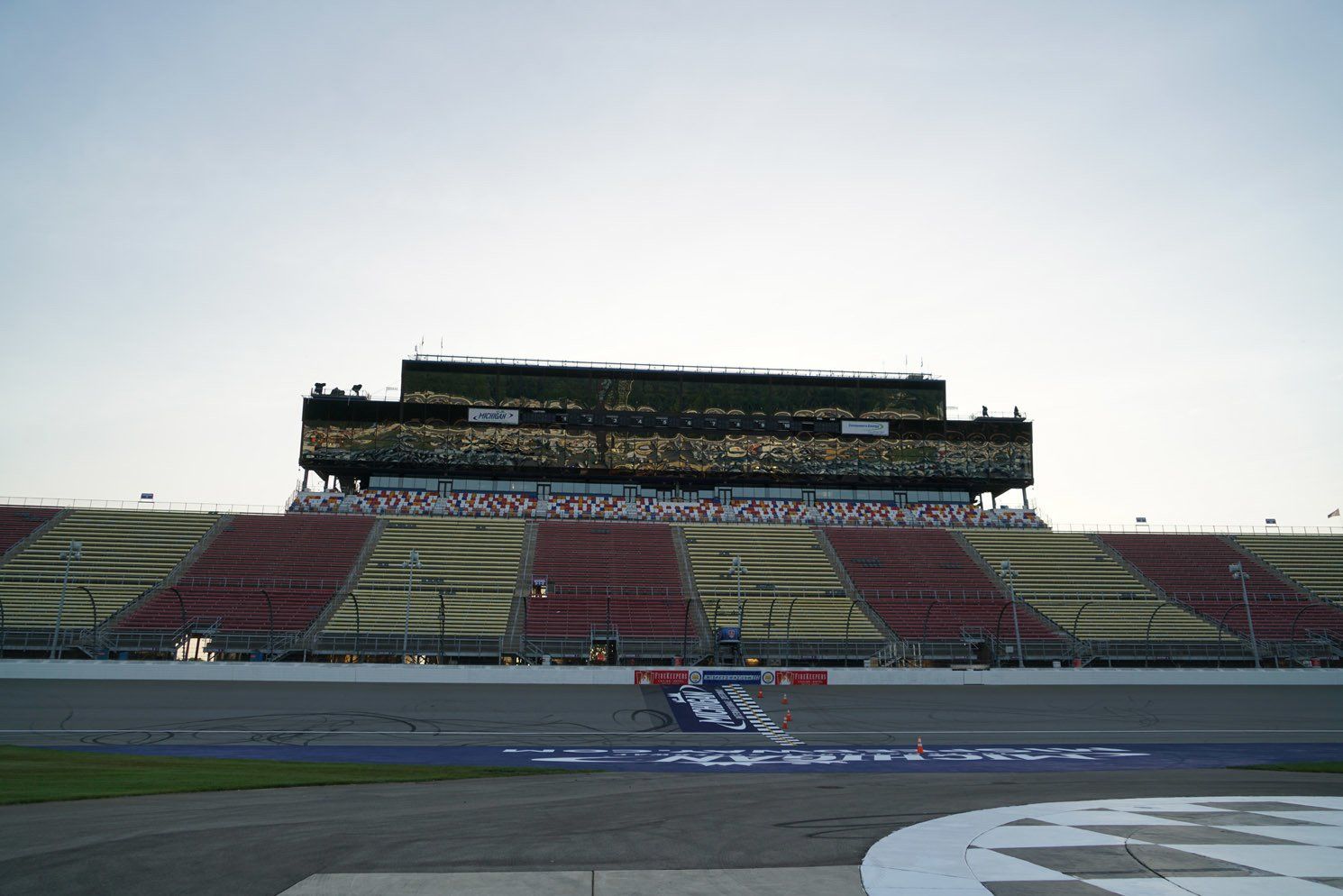A race track with a stadium in the background