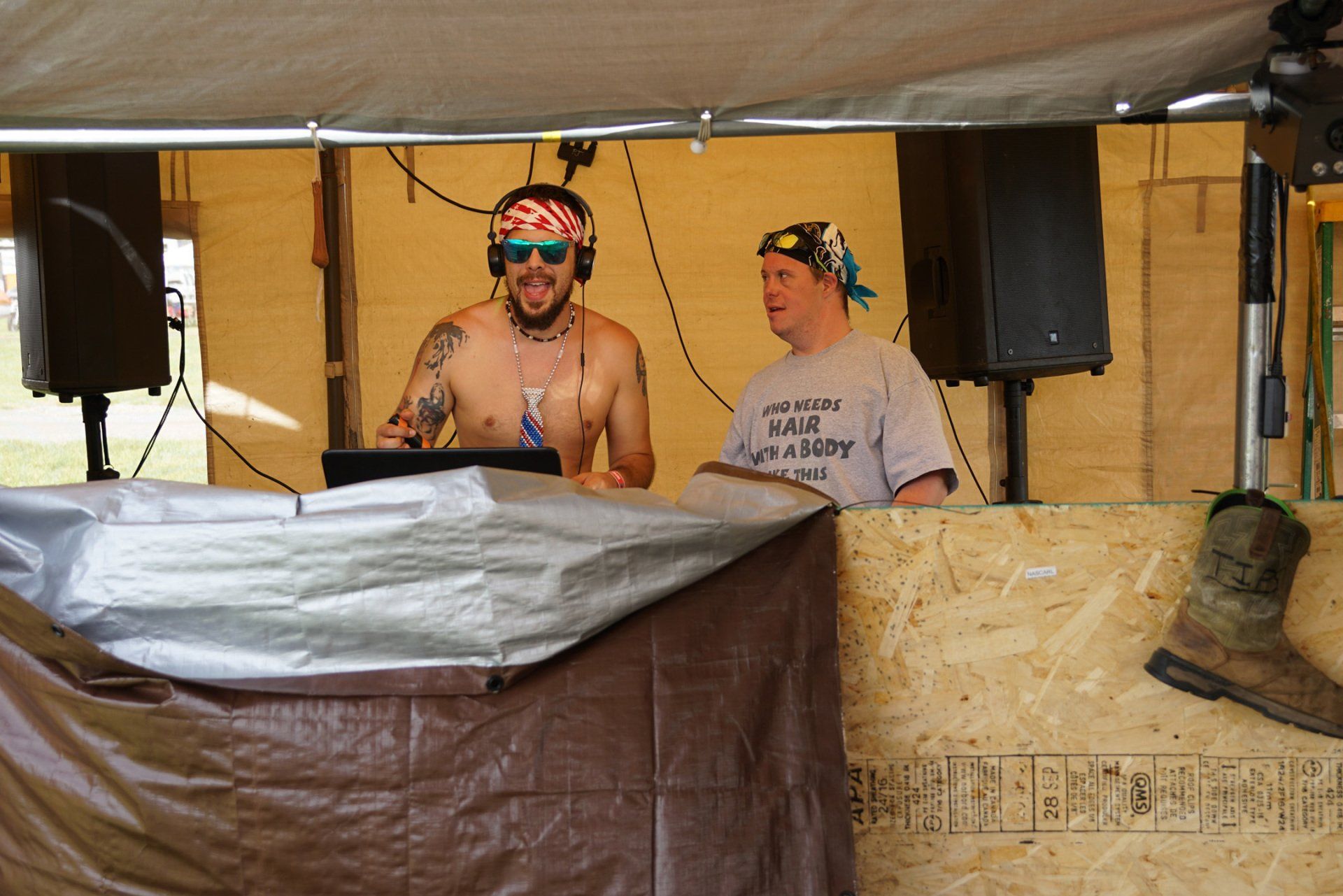 A man wearing a shirt that says ' i 'm a hero ' on it