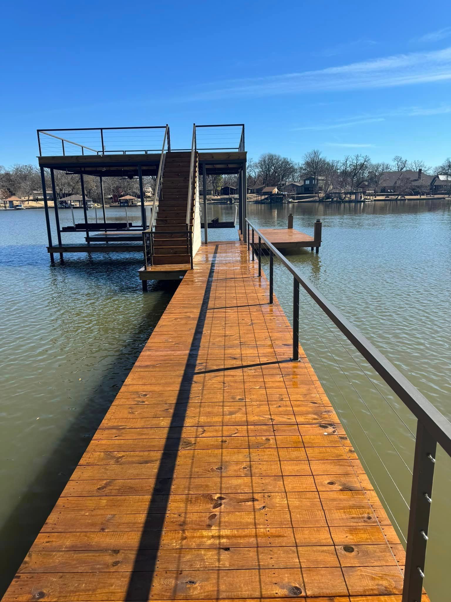 A wooden dock leading into a body of water.
