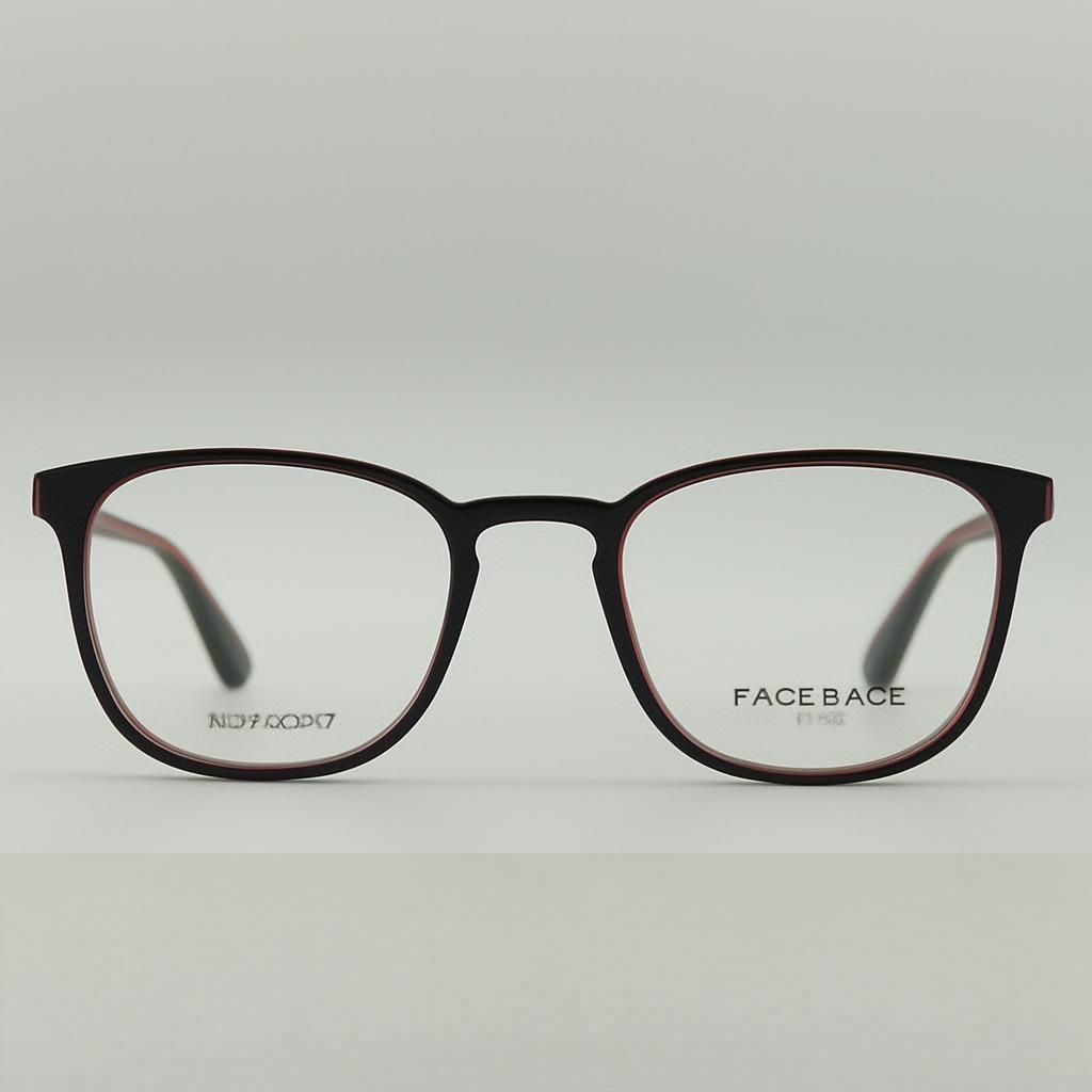 Black framed eyeglasses on a white surface, clear lenses.