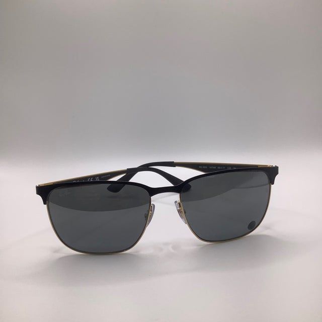 Black sunglasses with dark grey lenses on a white background.