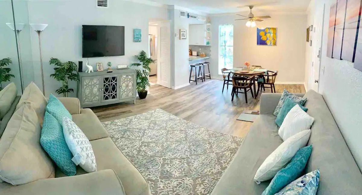 A living room filled with furniture and a flat screen tv.