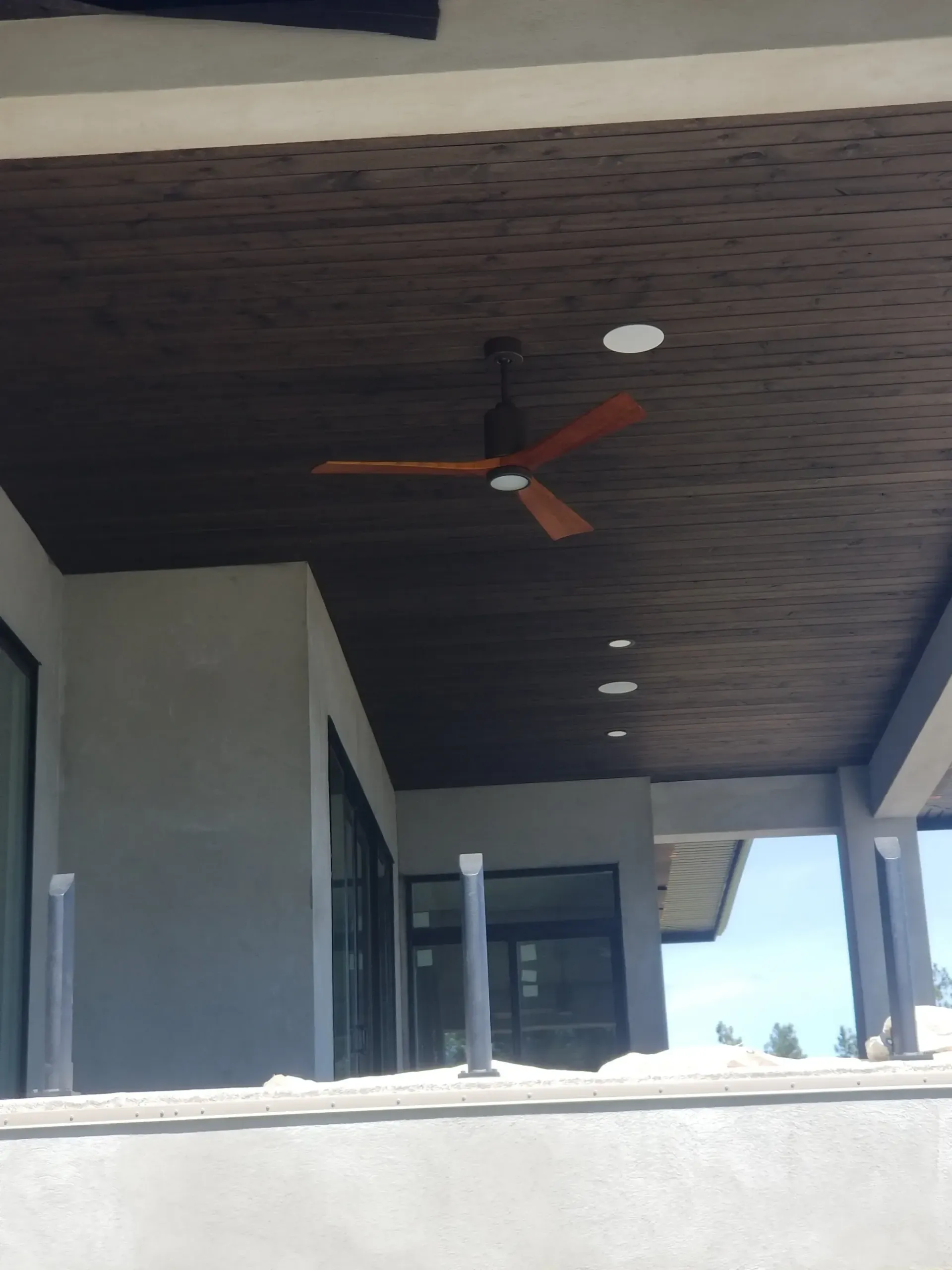A ceiling fan is hanging from the ceiling of a house