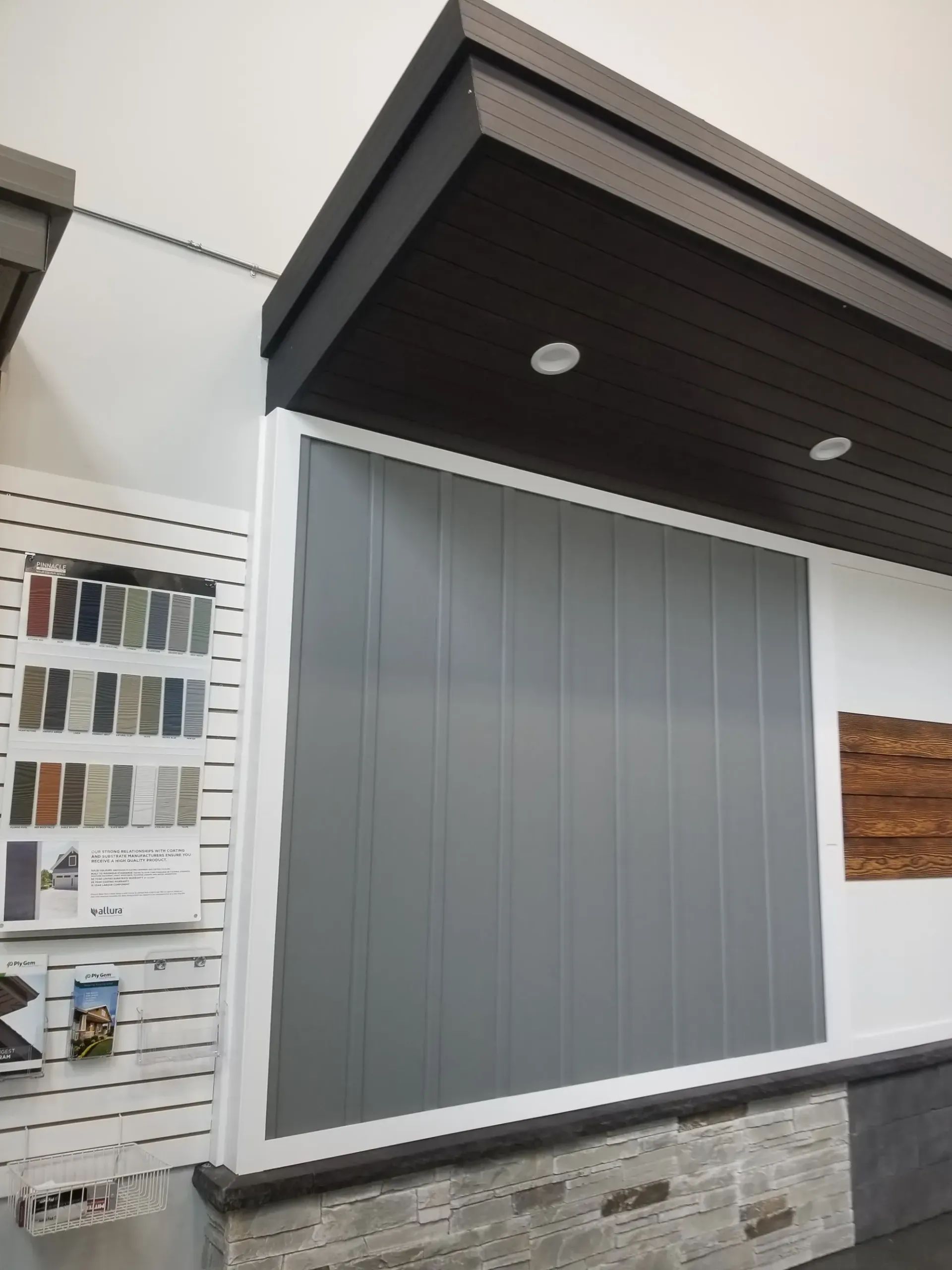 A room with a gray wall and a ceiling