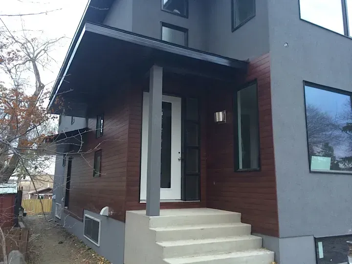 The front of a house with a porch and stairs