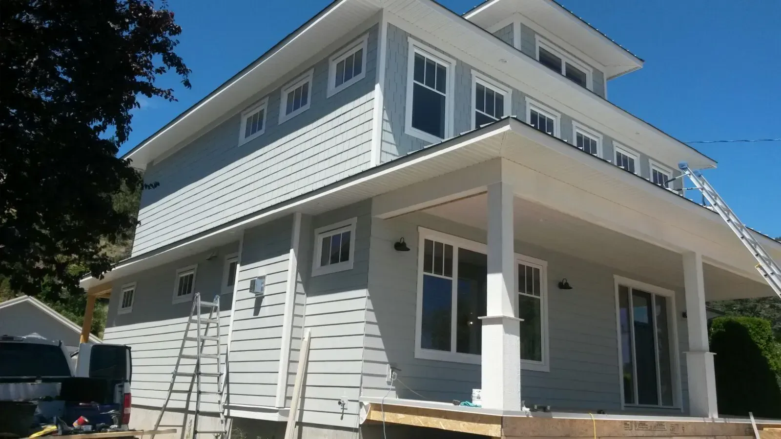 A house with a ladder on the side of it