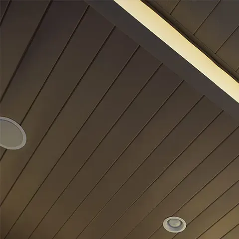 A close up of a ceiling with a light on it.